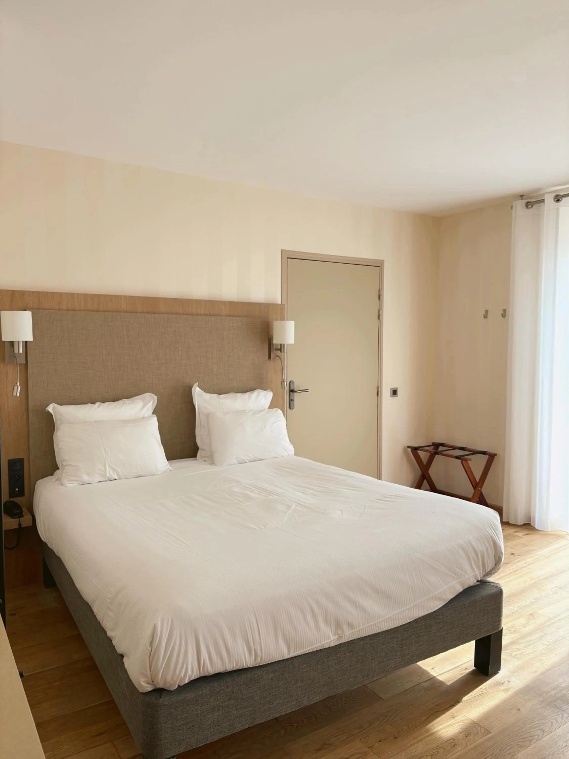 Photo of the whole room, Bed in Logis Hôtel Saint Guirec Et De La Plage