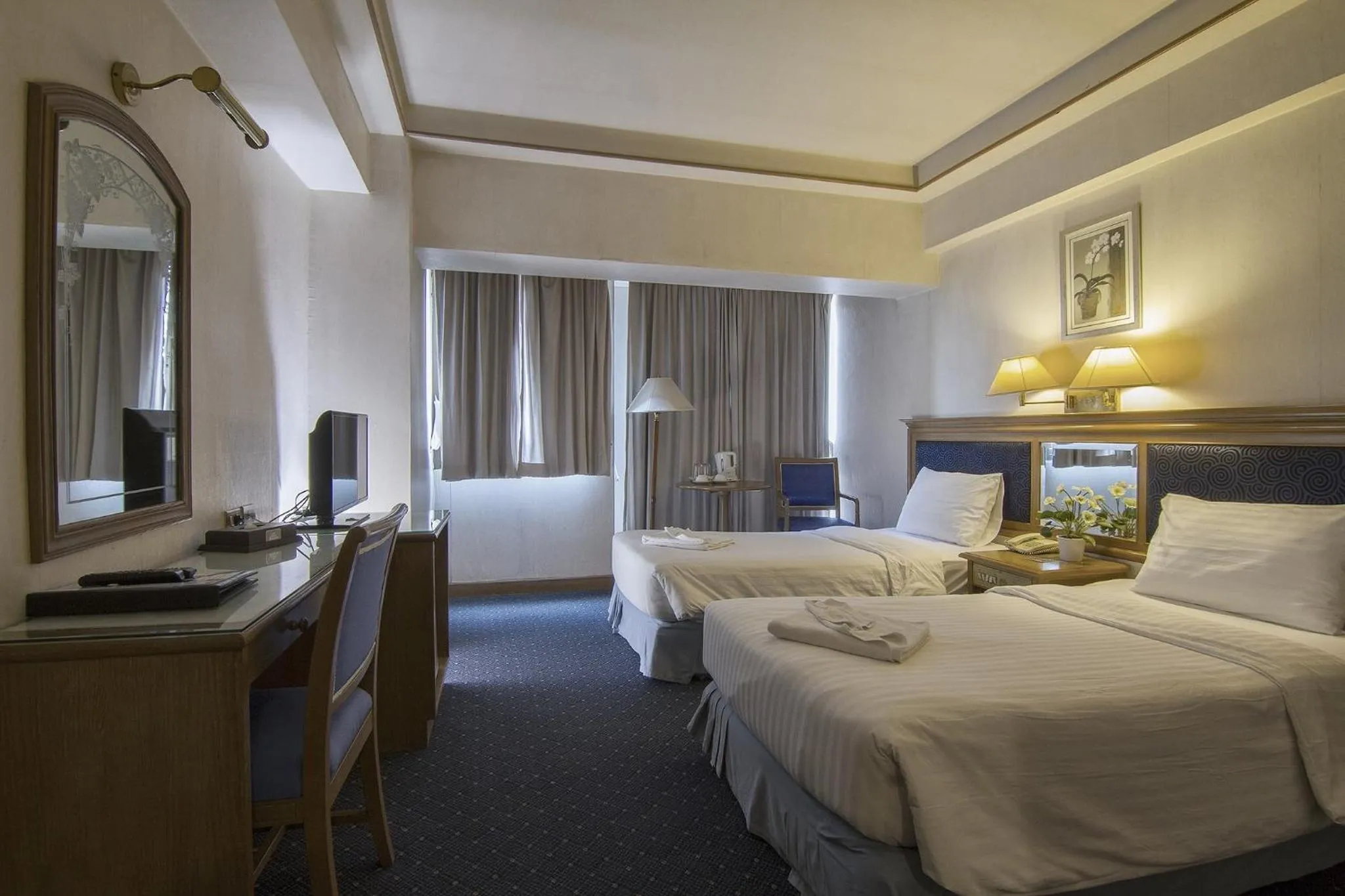 Bed in Bossotel Chiang Mai