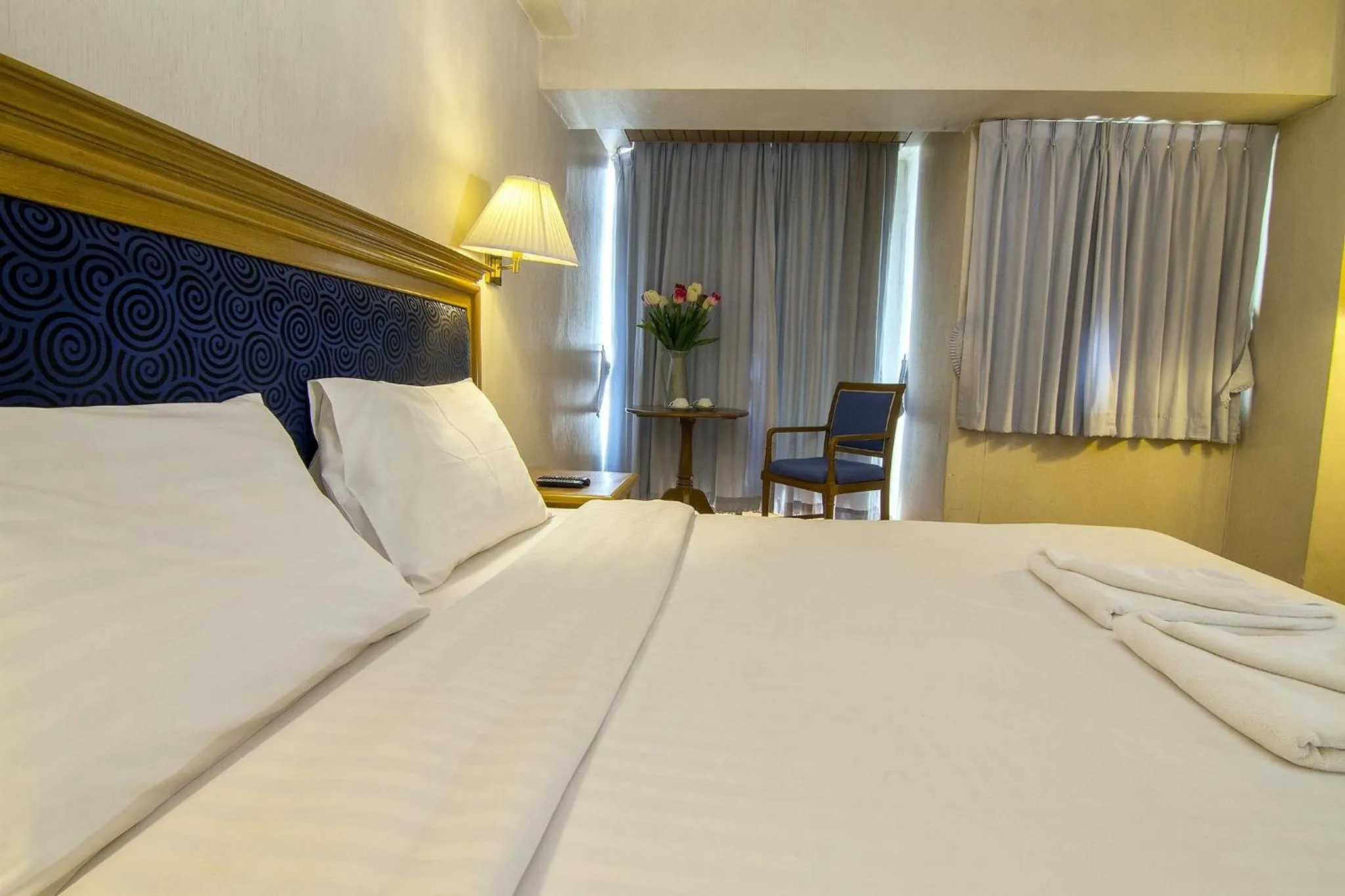 Bed in Bossotel Chiang Mai