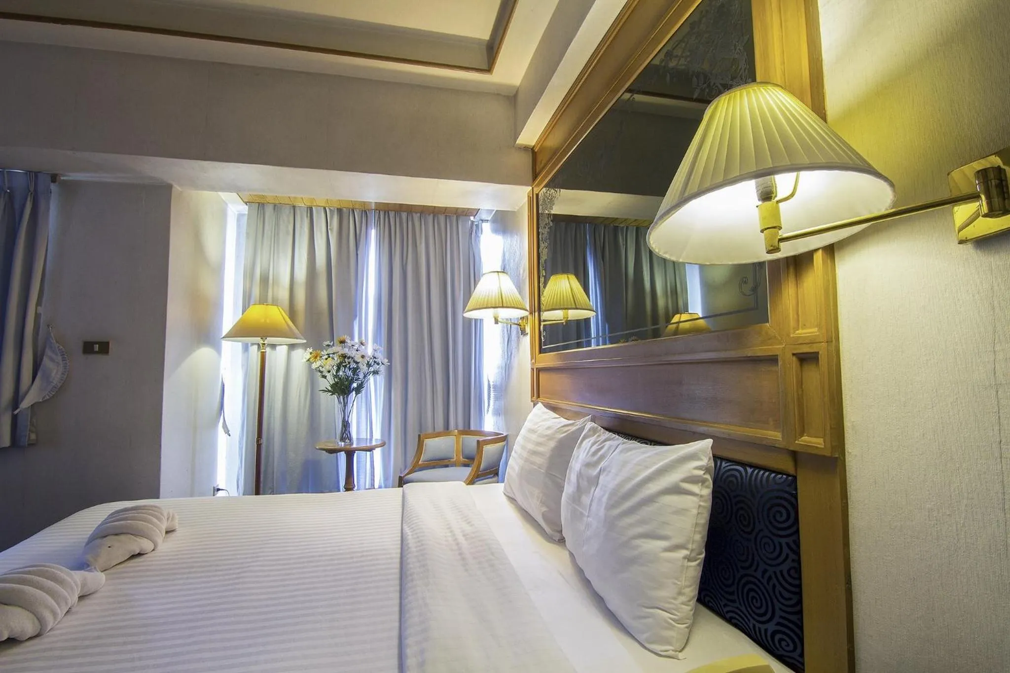 Bed in Bossotel Chiang Mai