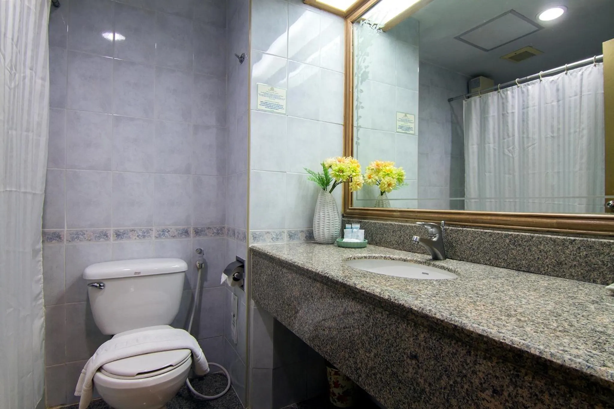 Bathroom in Bossotel Chiang Mai