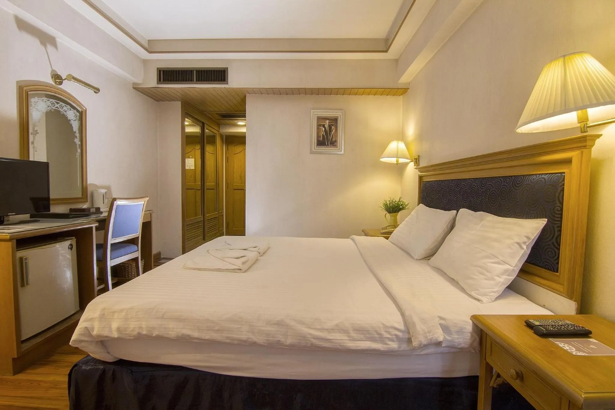 Bed in Bossotel Chiang Mai