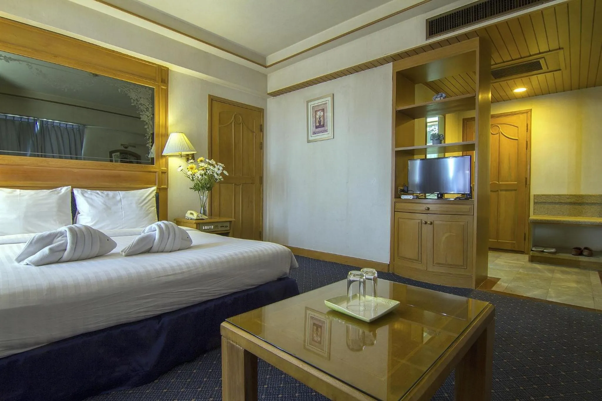 Bed in Bossotel Chiang Mai