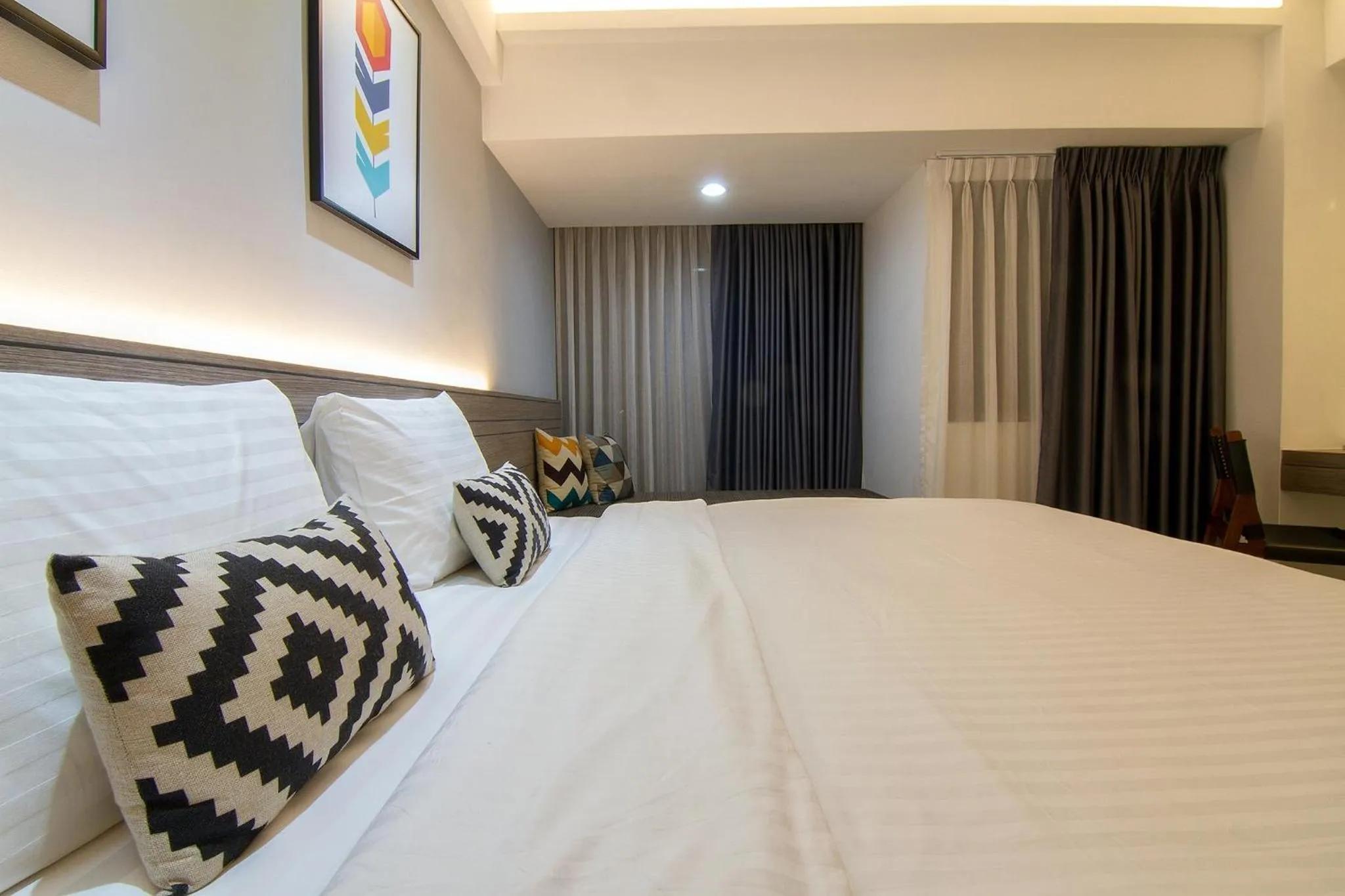 Bed in Bossotel Chiang Mai