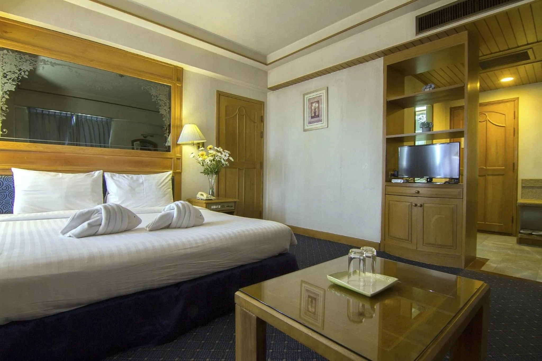 Bed in Bossotel Chiang Mai