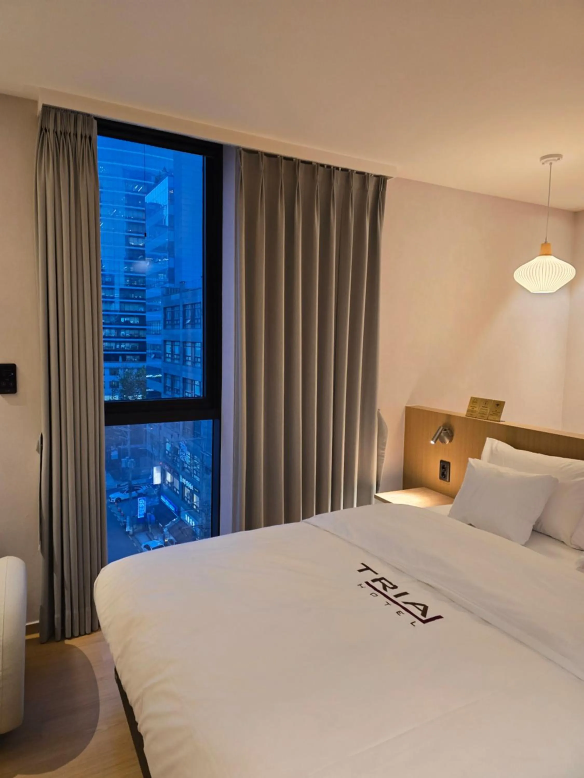 Bed in Tria Business & Boutique Hotel