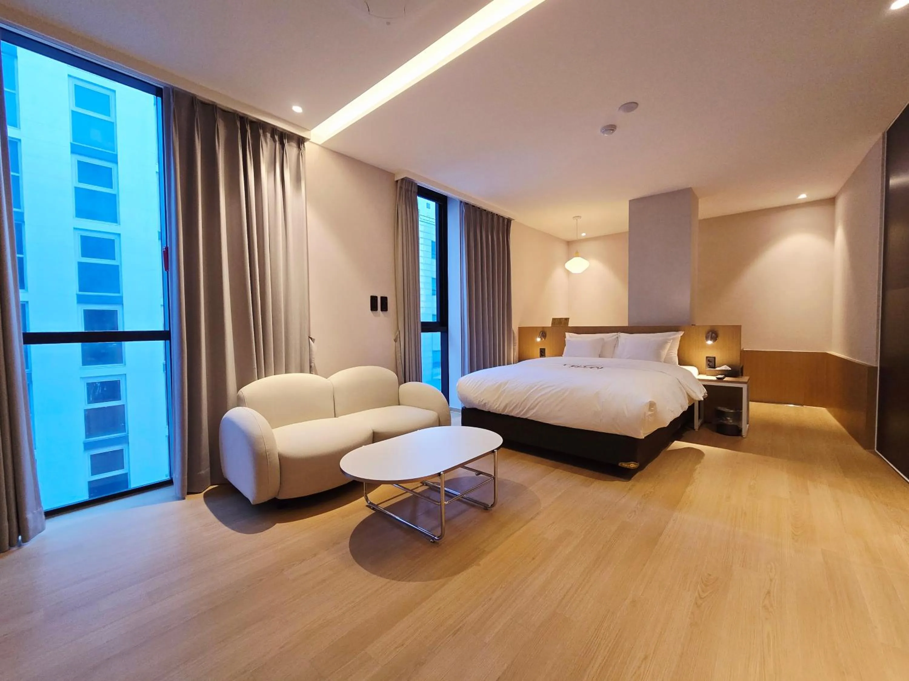 Bed in Tria Business & Boutique Hotel