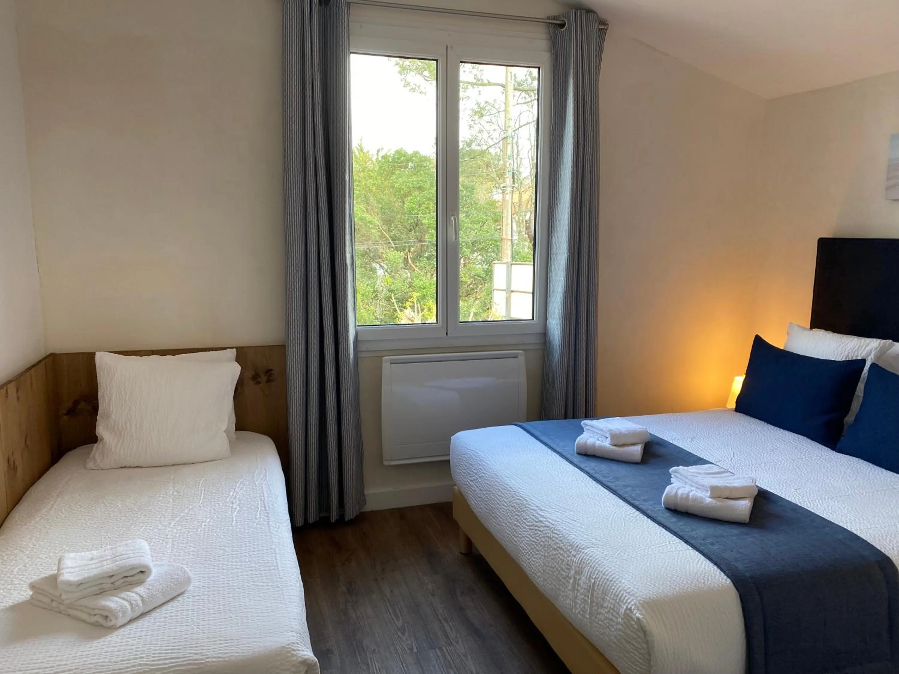 Photo of the whole room, Bed in Logis Hôtel Emeraude des Bois