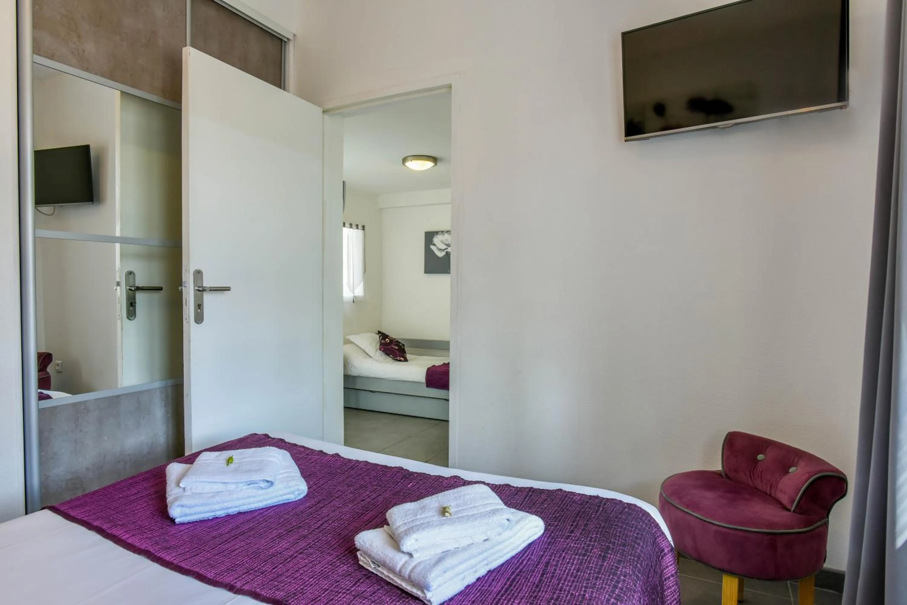 Bed in Logis Hôtel Emeraude des Bois