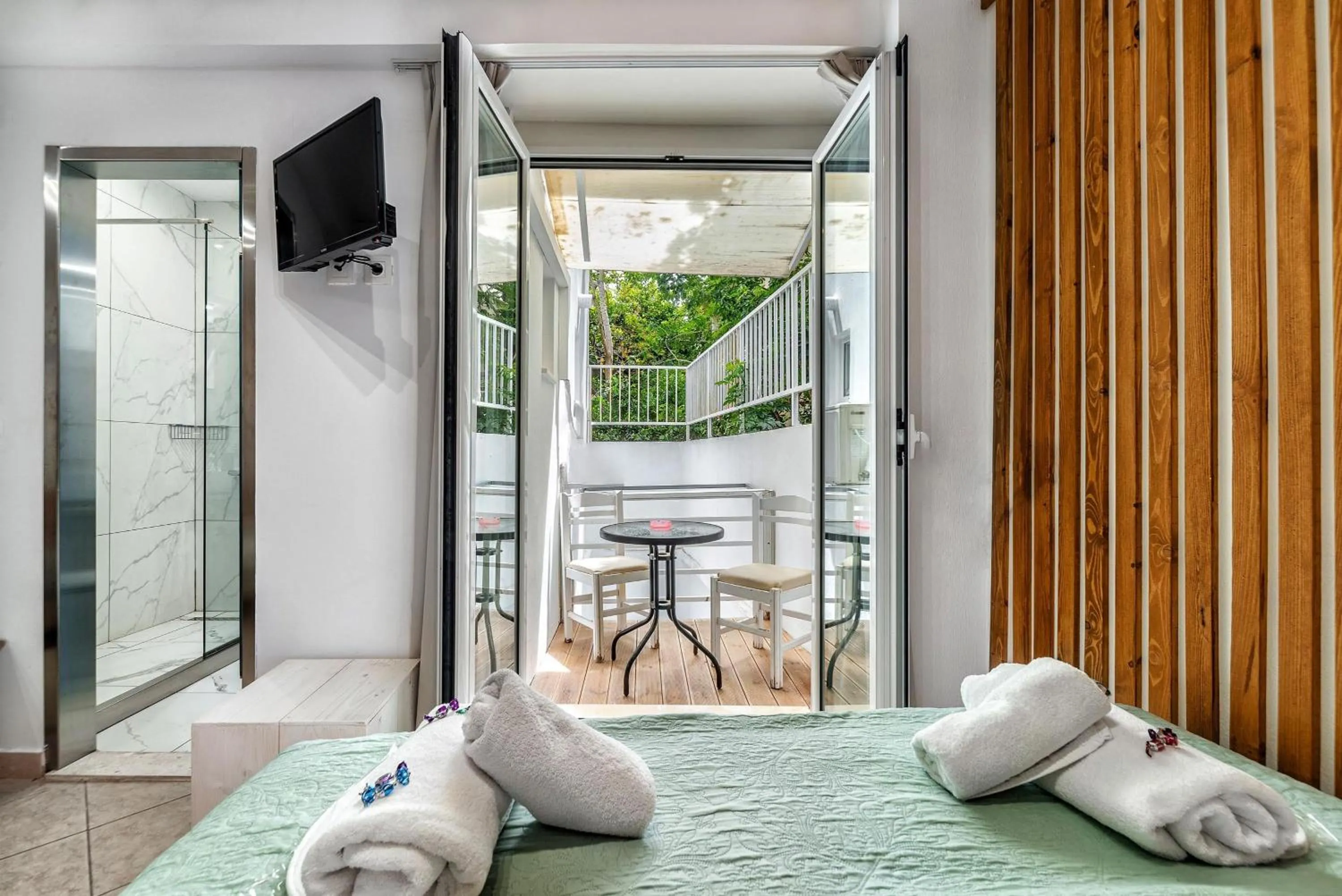 Bed in City Center Studios by Cretan Houses