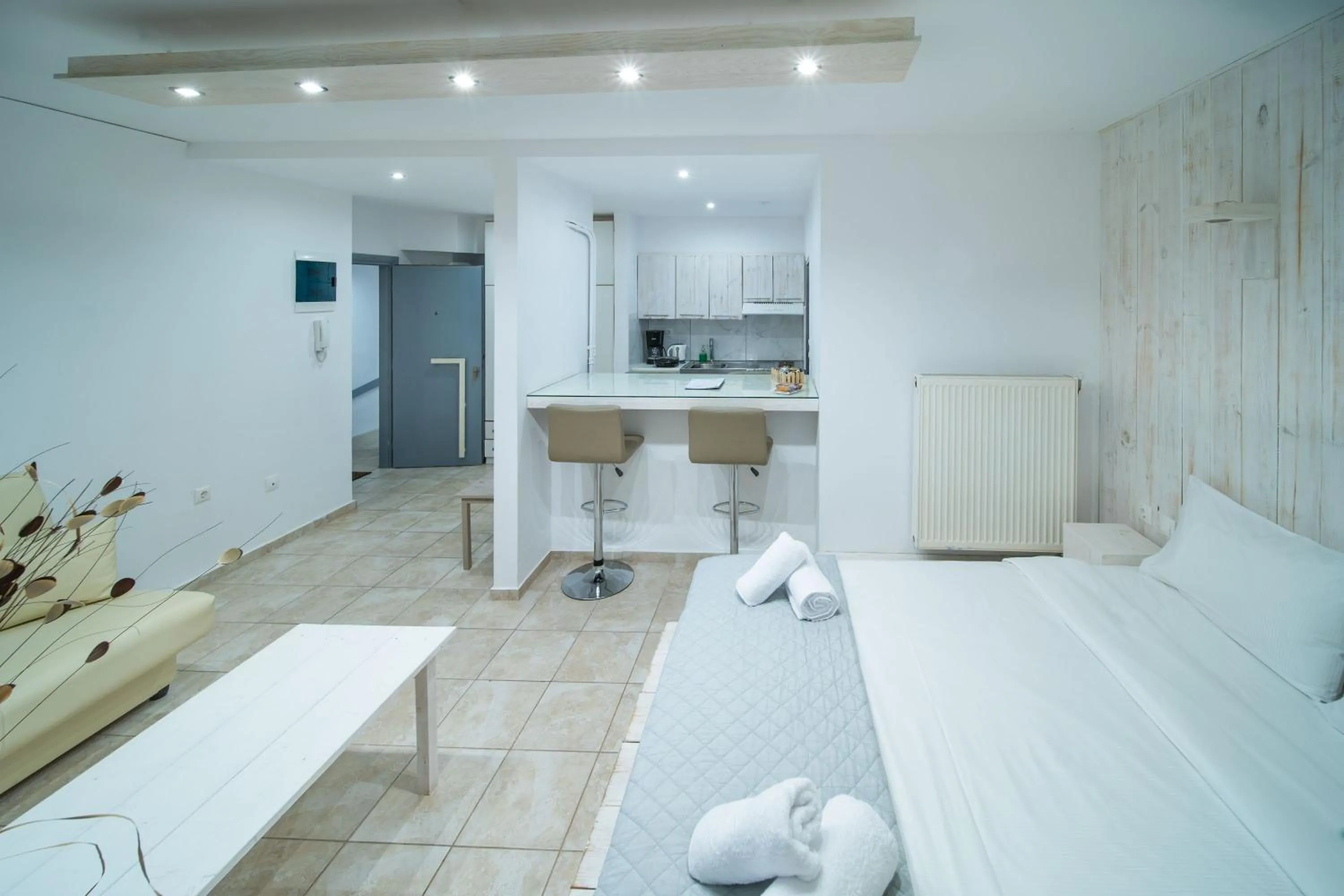 Bed in City Center Studios by Cretan Houses