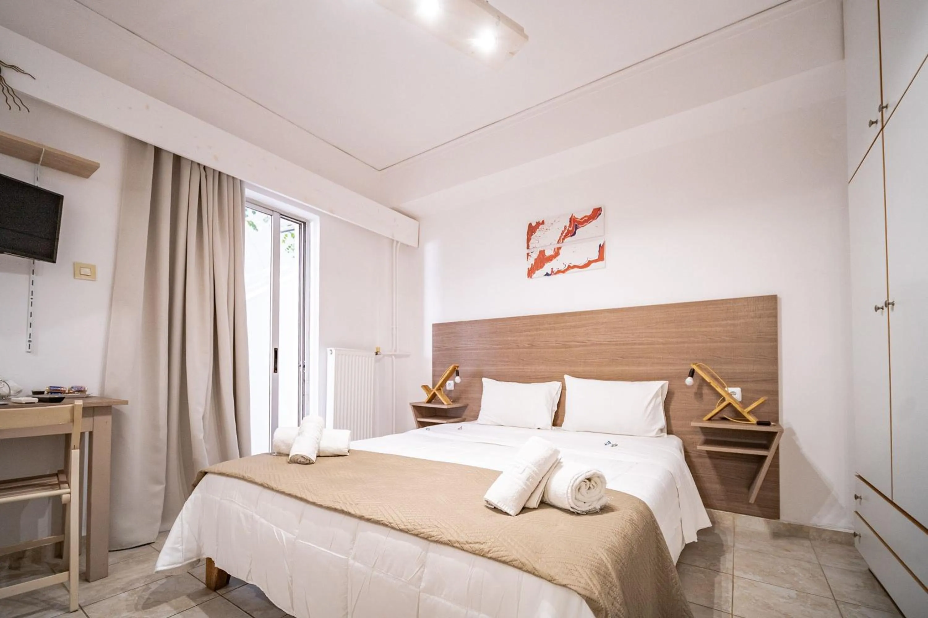Bed in City Center Studios by Cretan Houses