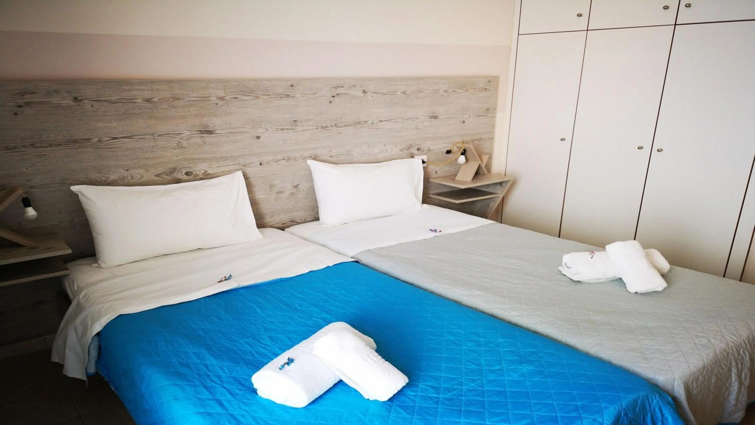 Bed in City Center Studios by Cretan Houses