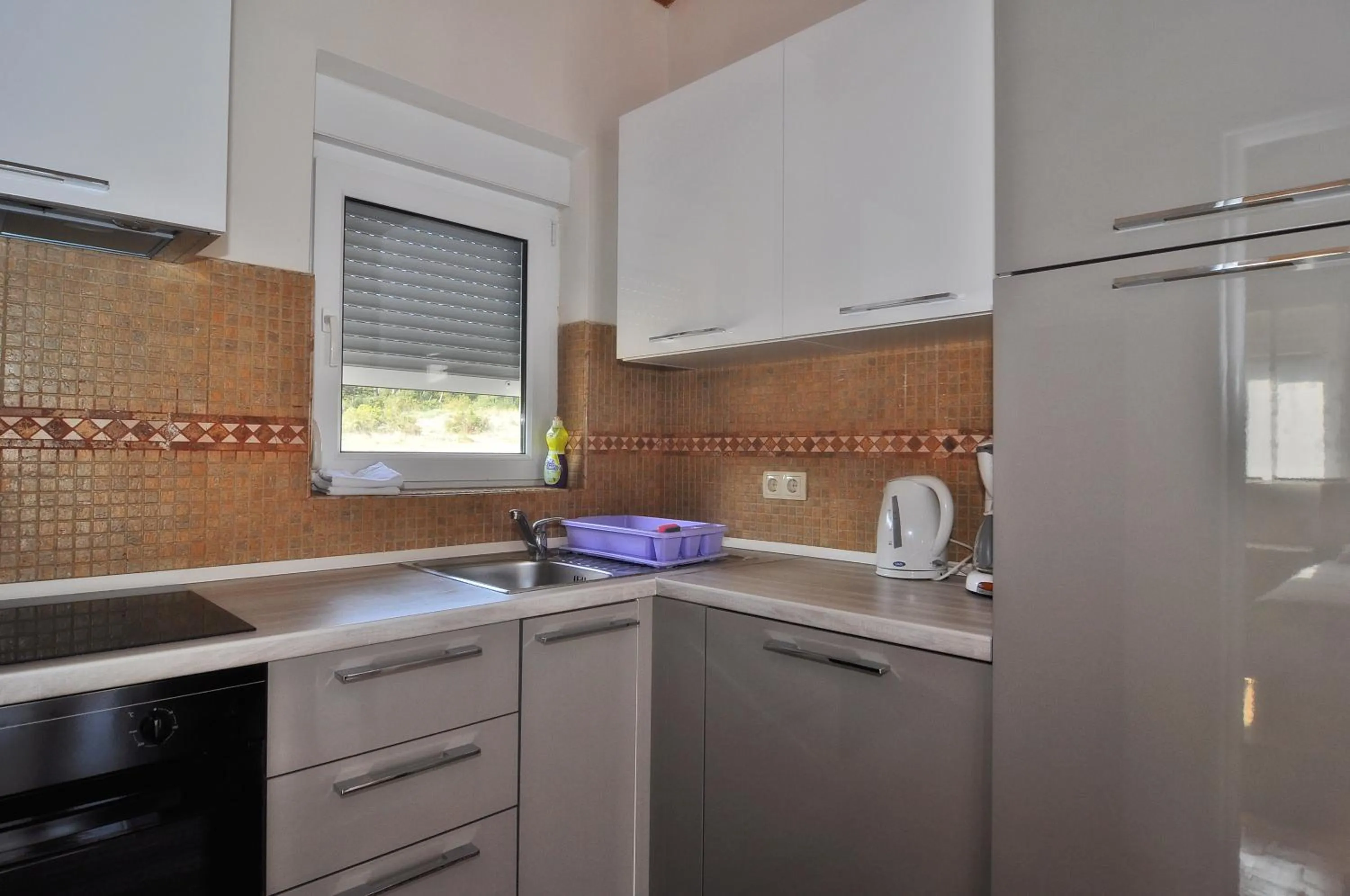 Kitchen or kitchenette in Villa Vanilla with Heated Pool