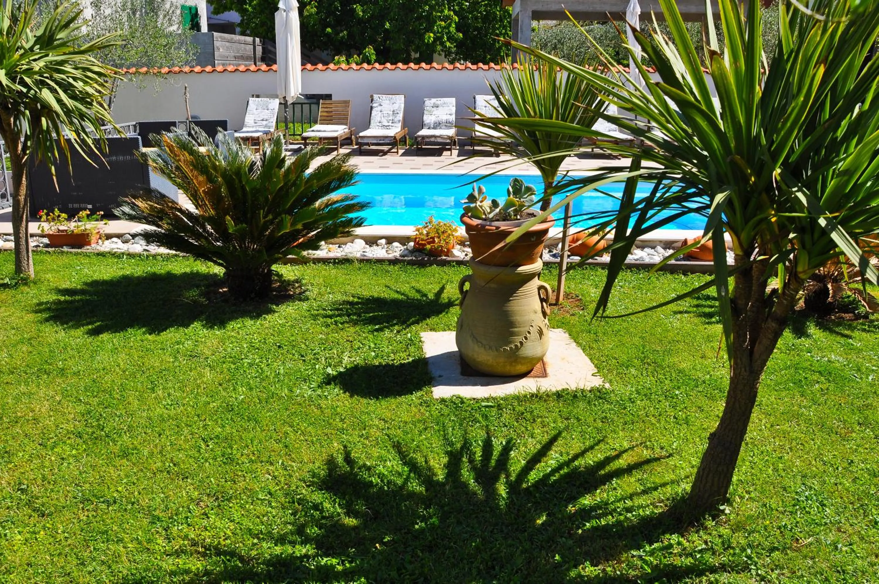 Garden in Villa Vanilla with Heated Pool