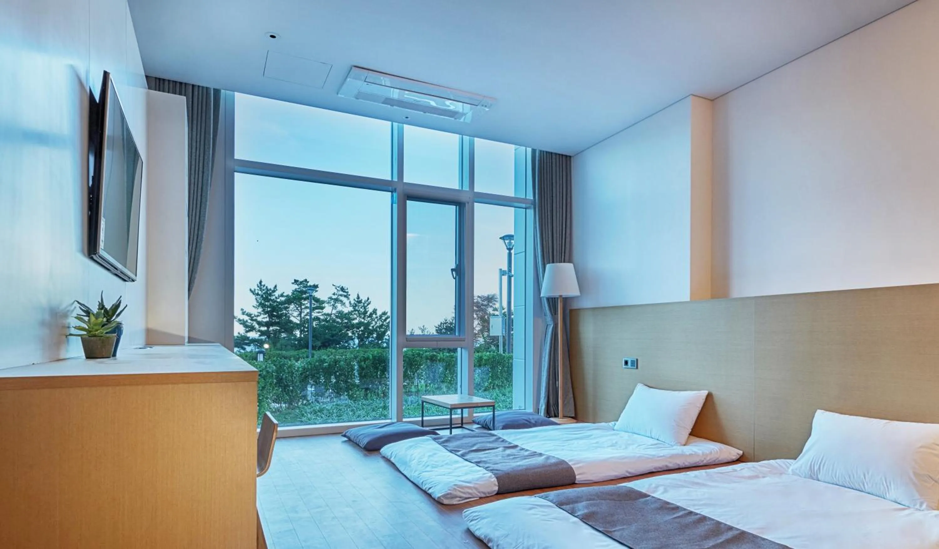 Bed in Naksan Beach Hotel