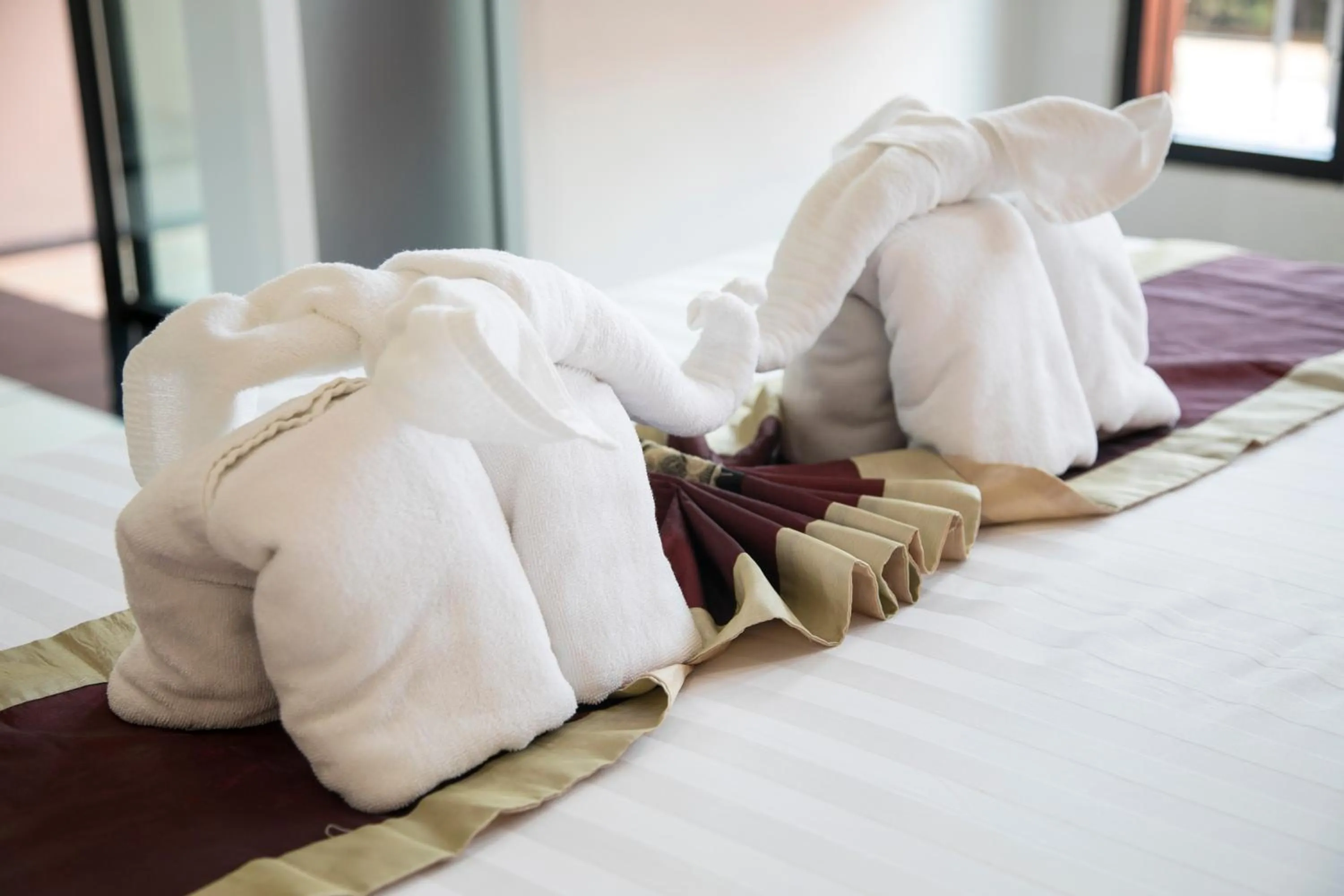towels, Bed in West Key Kamala Apartment