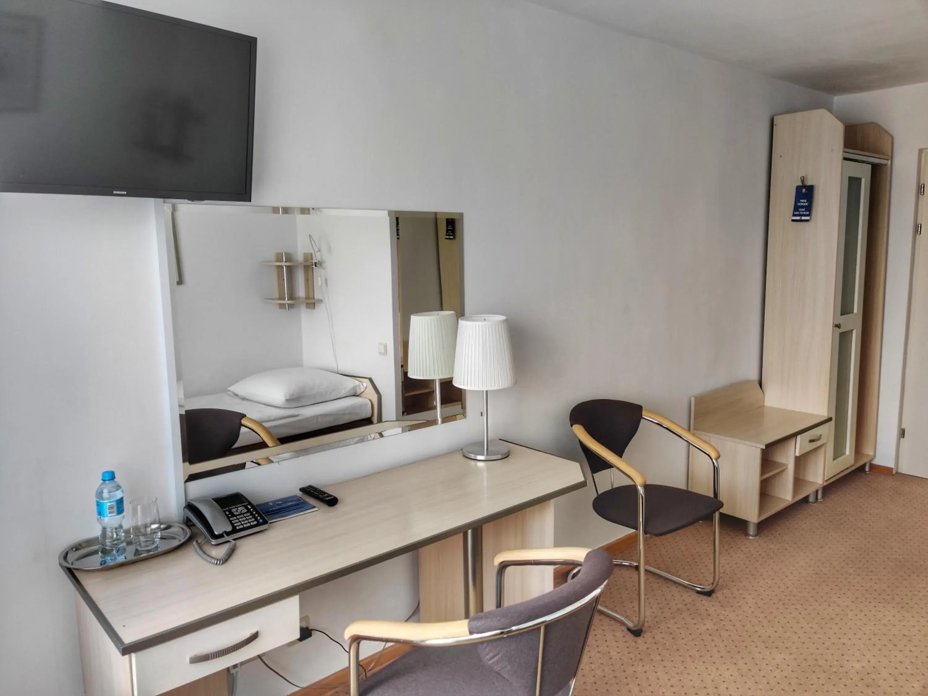 Single Room in Hotel Logos Single Room in Hotel Logos