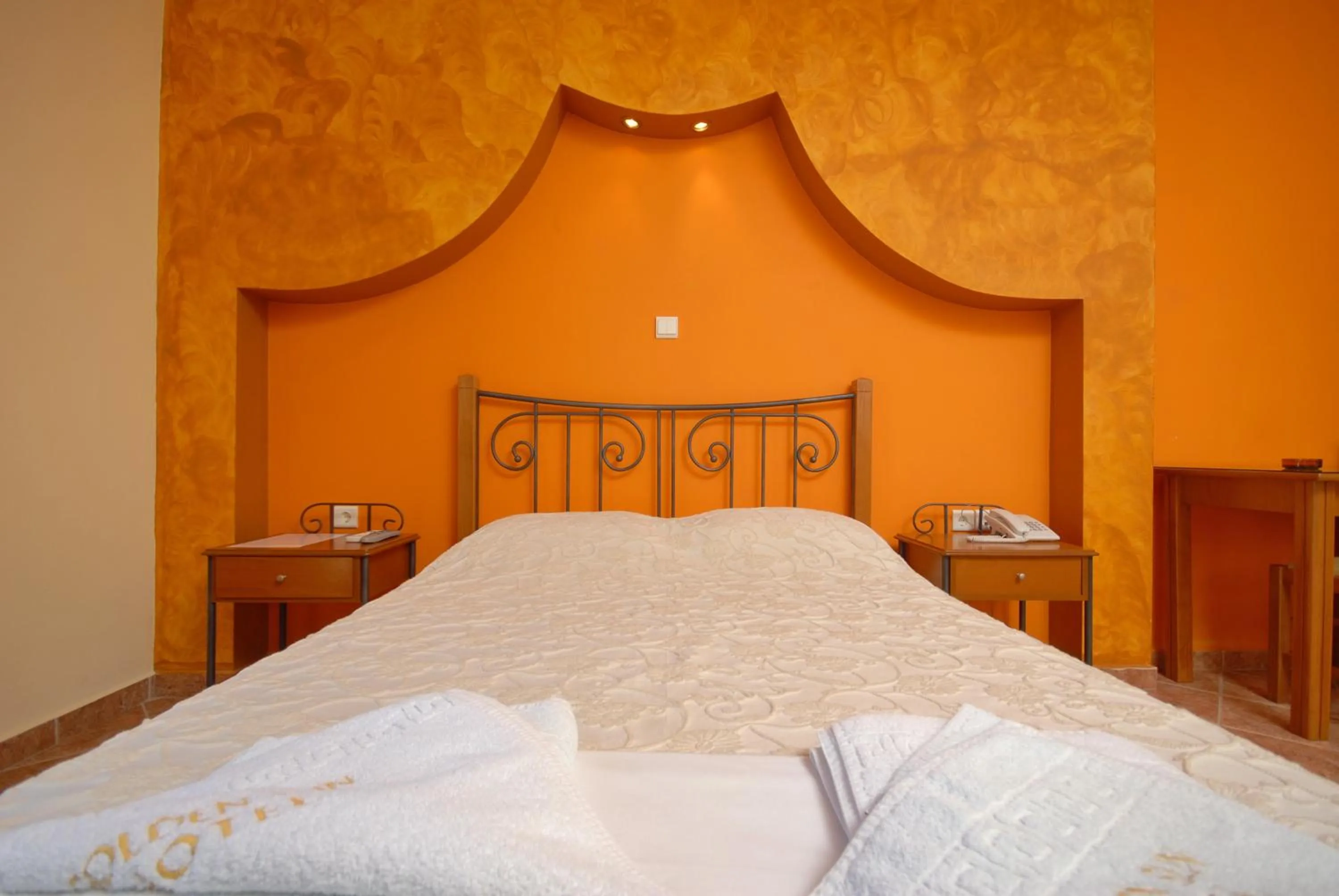 Bed in Golden Sun Hotel