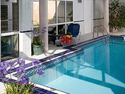 Swimming pool in Logis Hôtel Les Cimes