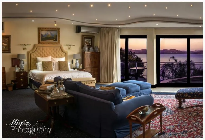 Bed in Kosmos Manor Guest House