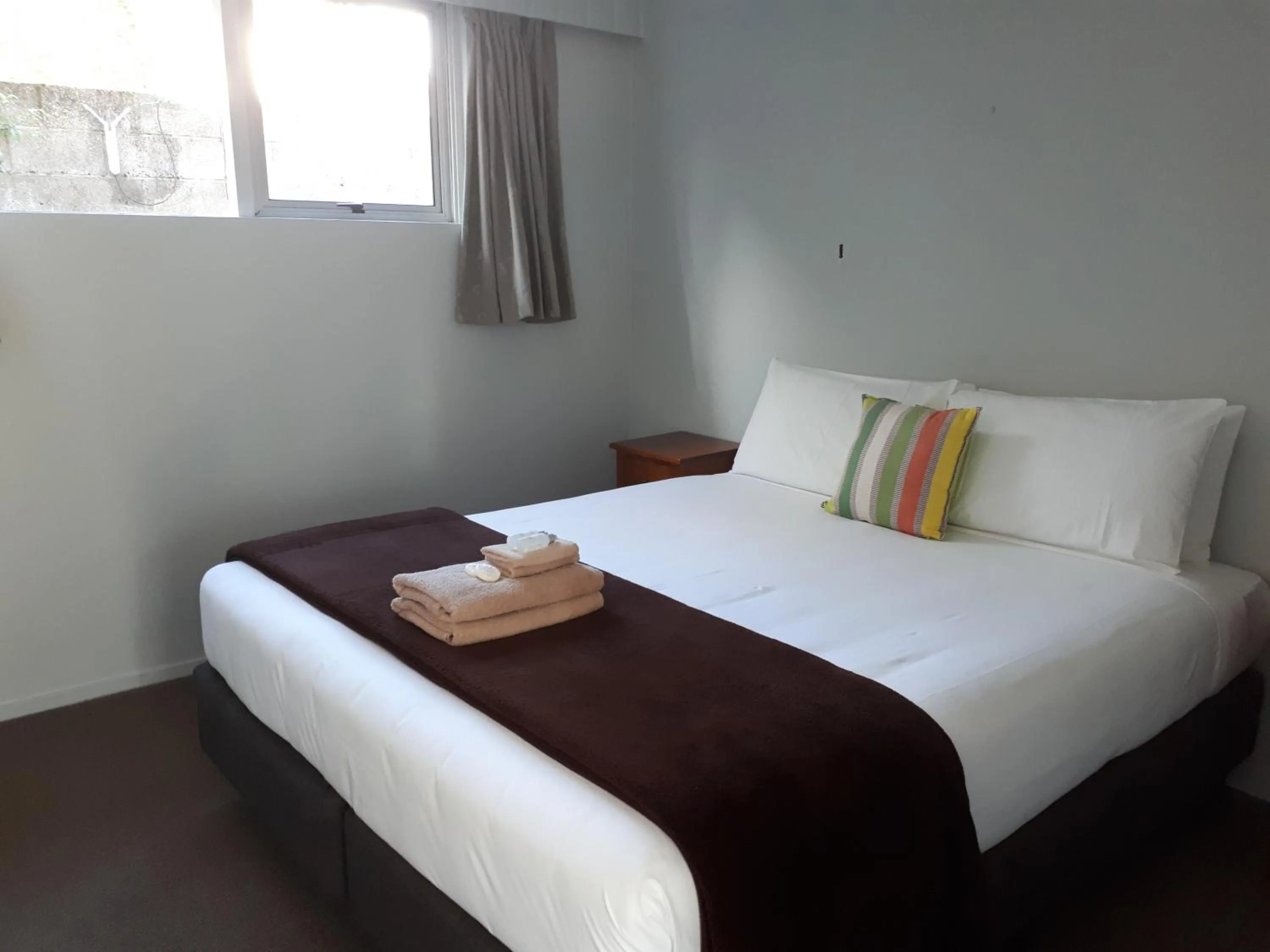 Bed in Edgewater Motel