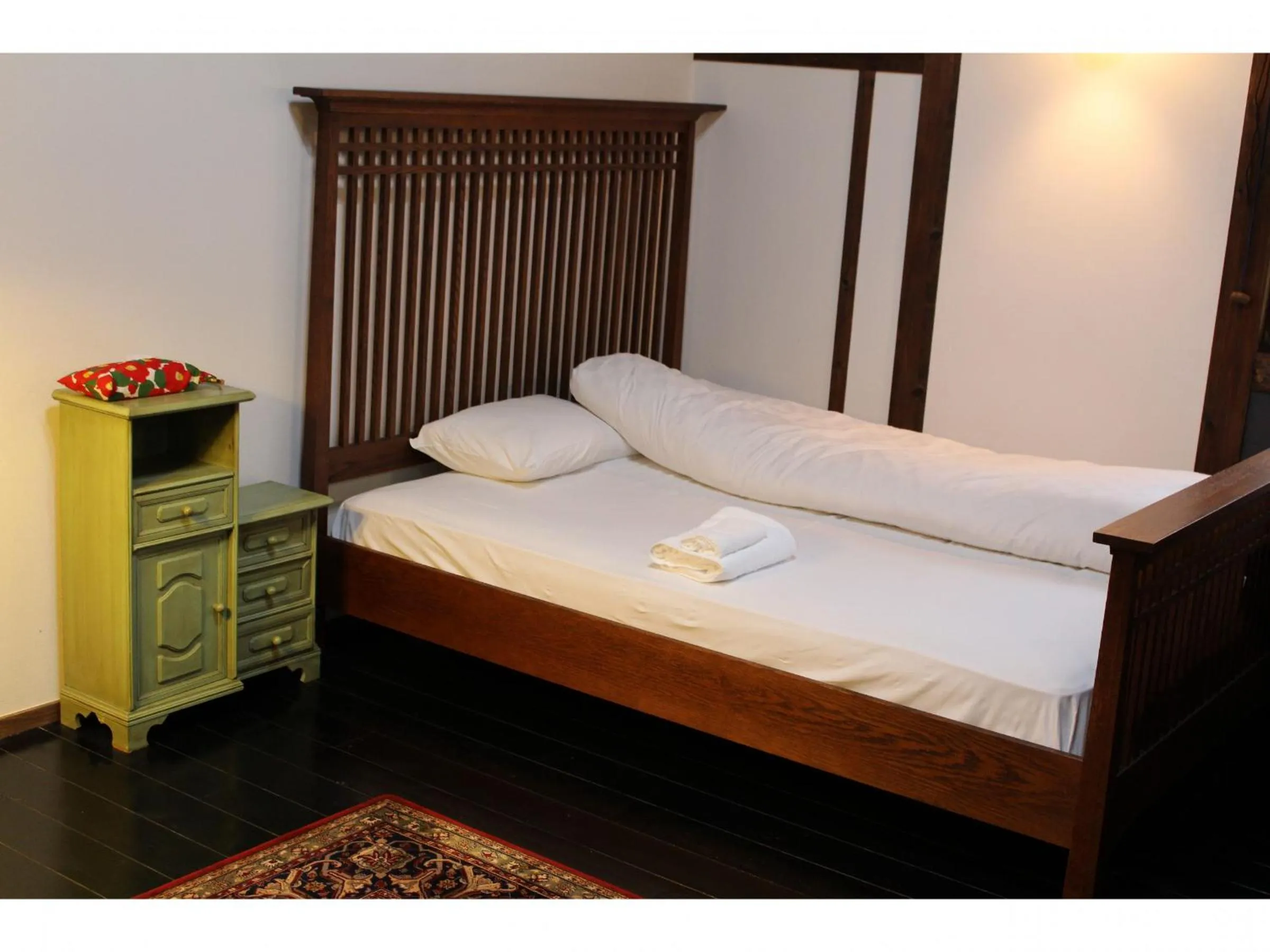 Bed in Kotohira Guest House en
