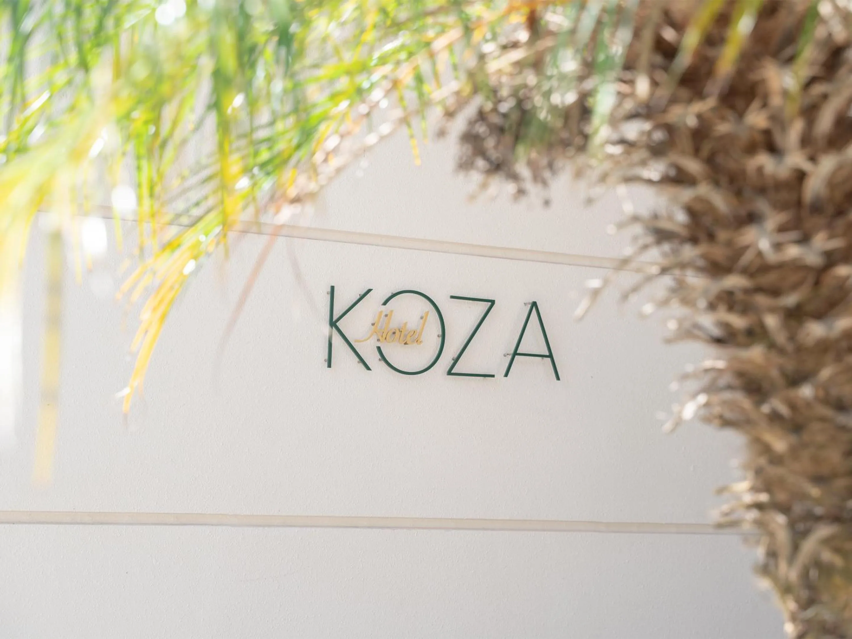 Property logo or sign in Hotel Koza