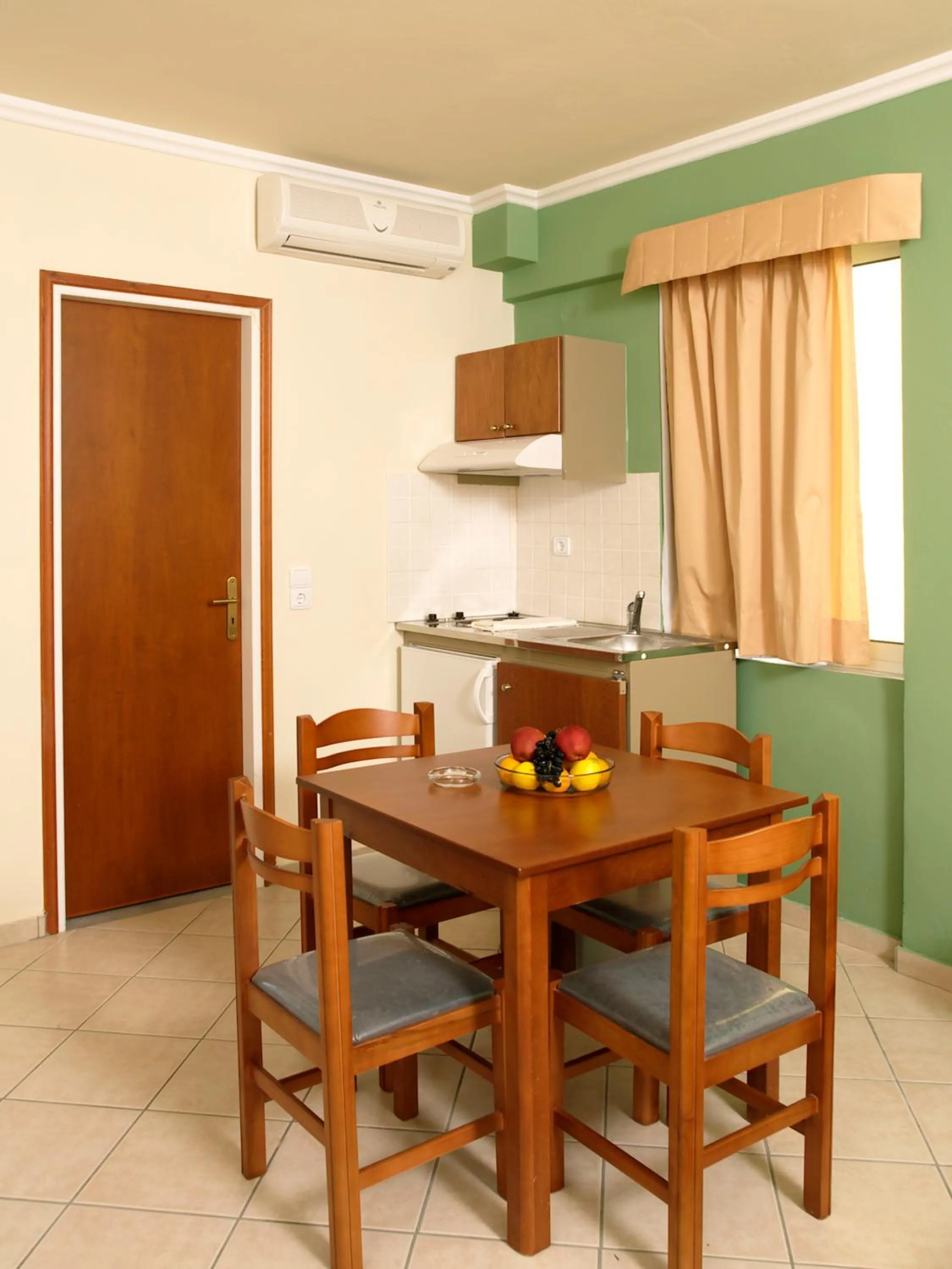 Kitchen or kitchenette in Porto Kalamaki Hotel