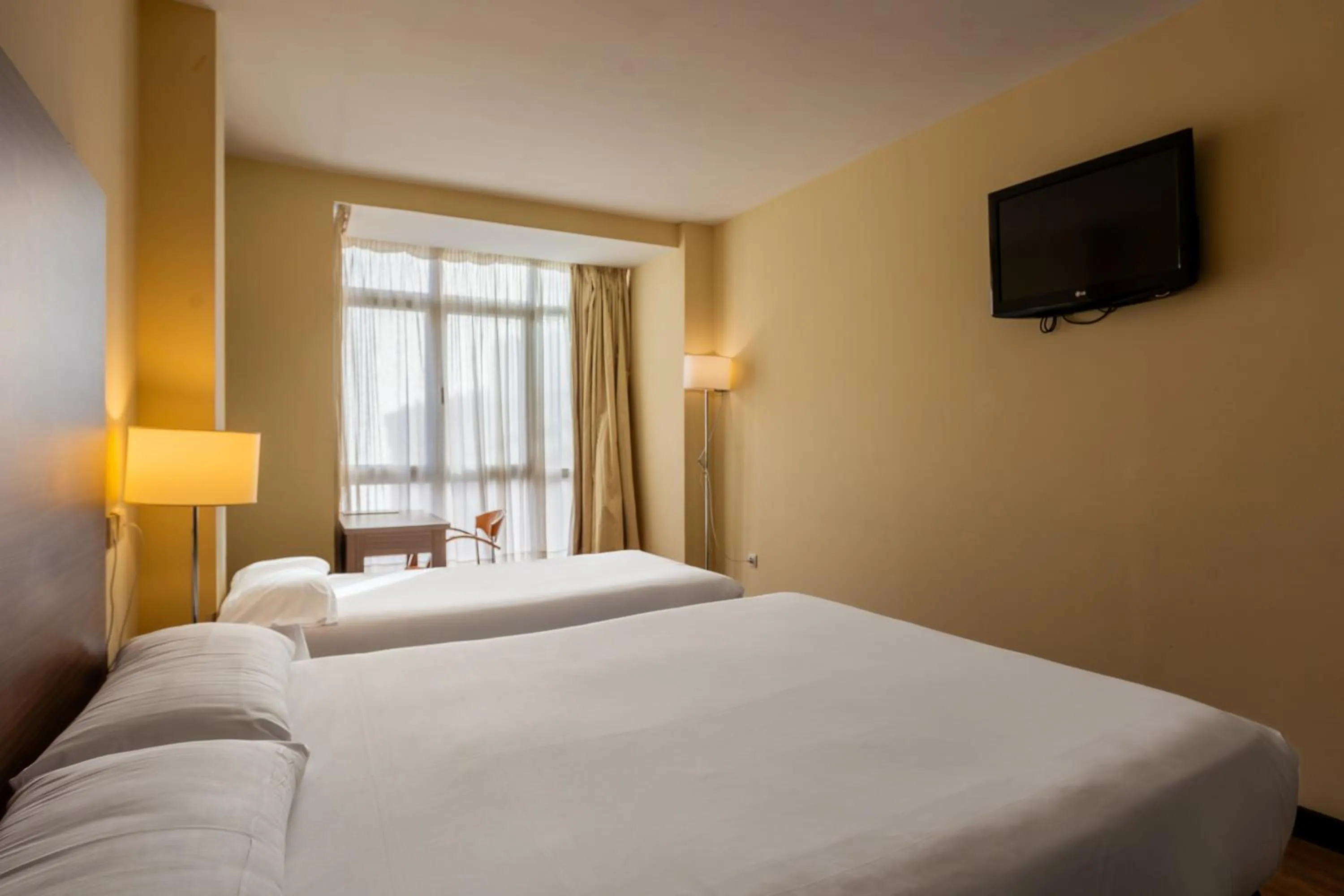 Bed in Hotel Centro Los Braseros