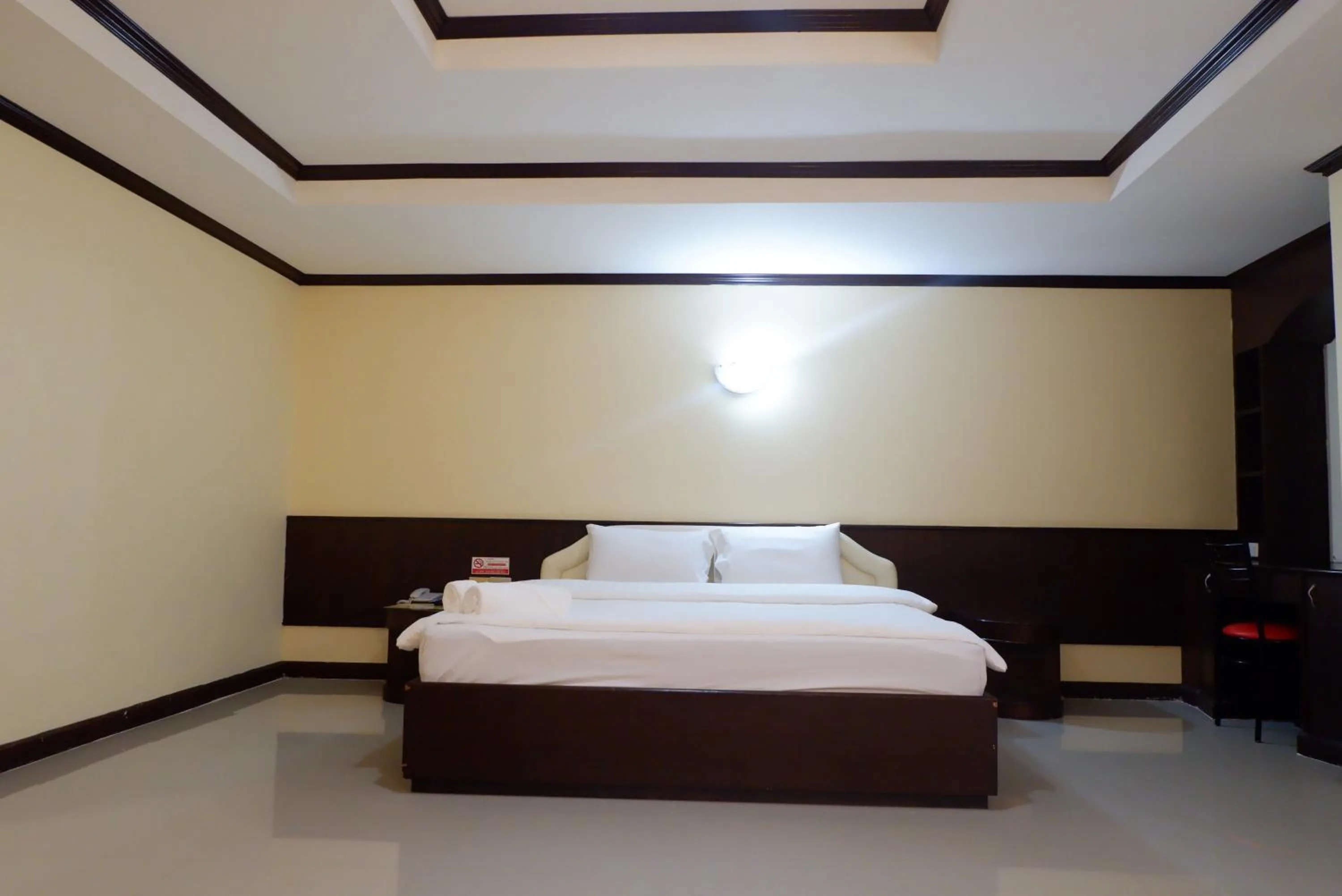 Bed in Auychai Grand Hotel