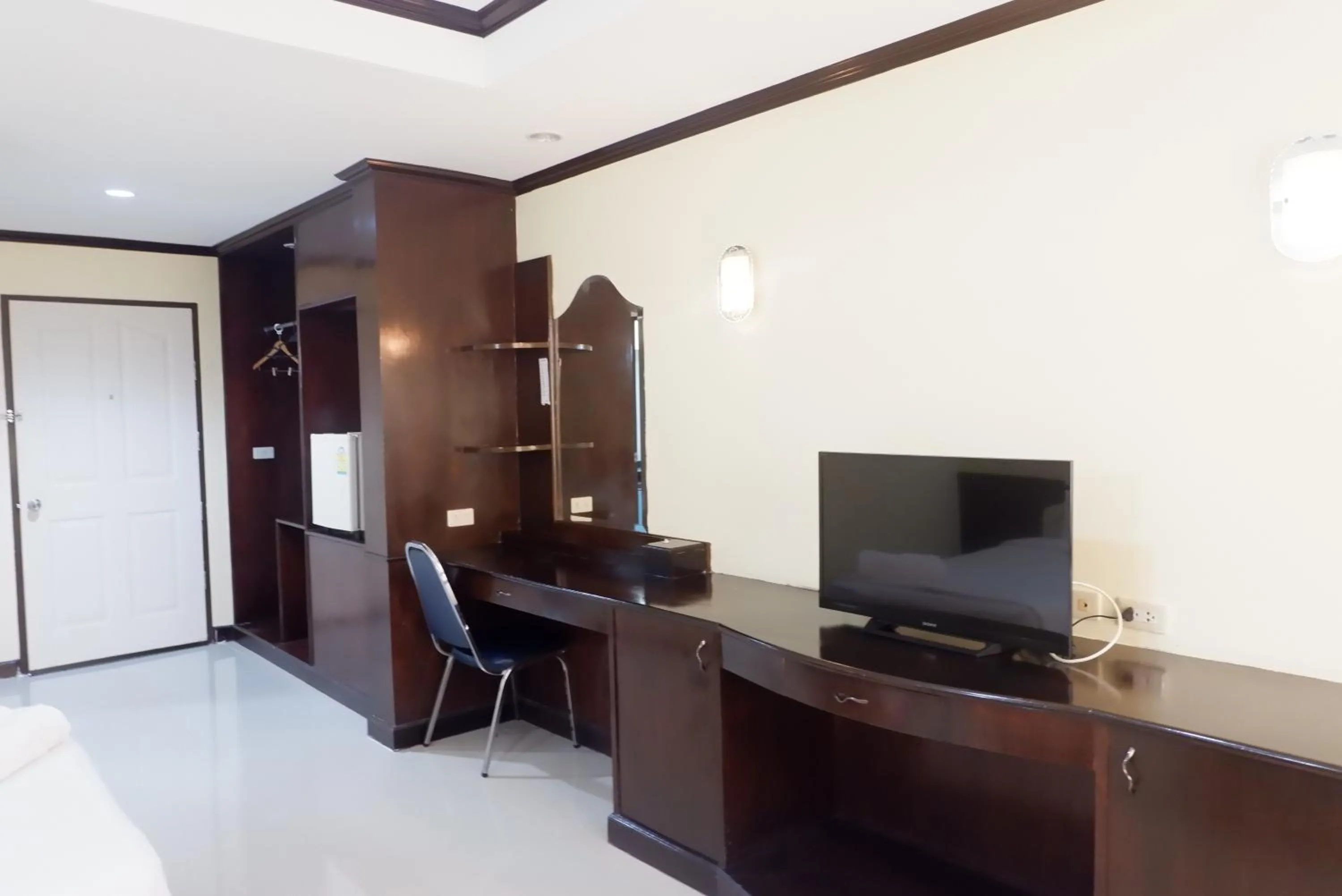 Communal lounge/ TV room in Auychai Grand Hotel