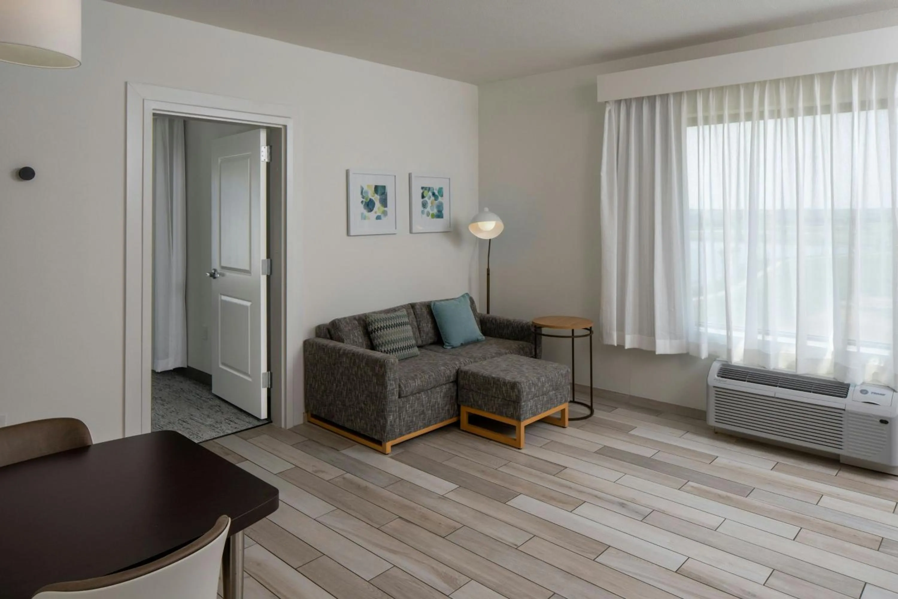 Living room in TownePlace Suites by Marriott Foley at OWA