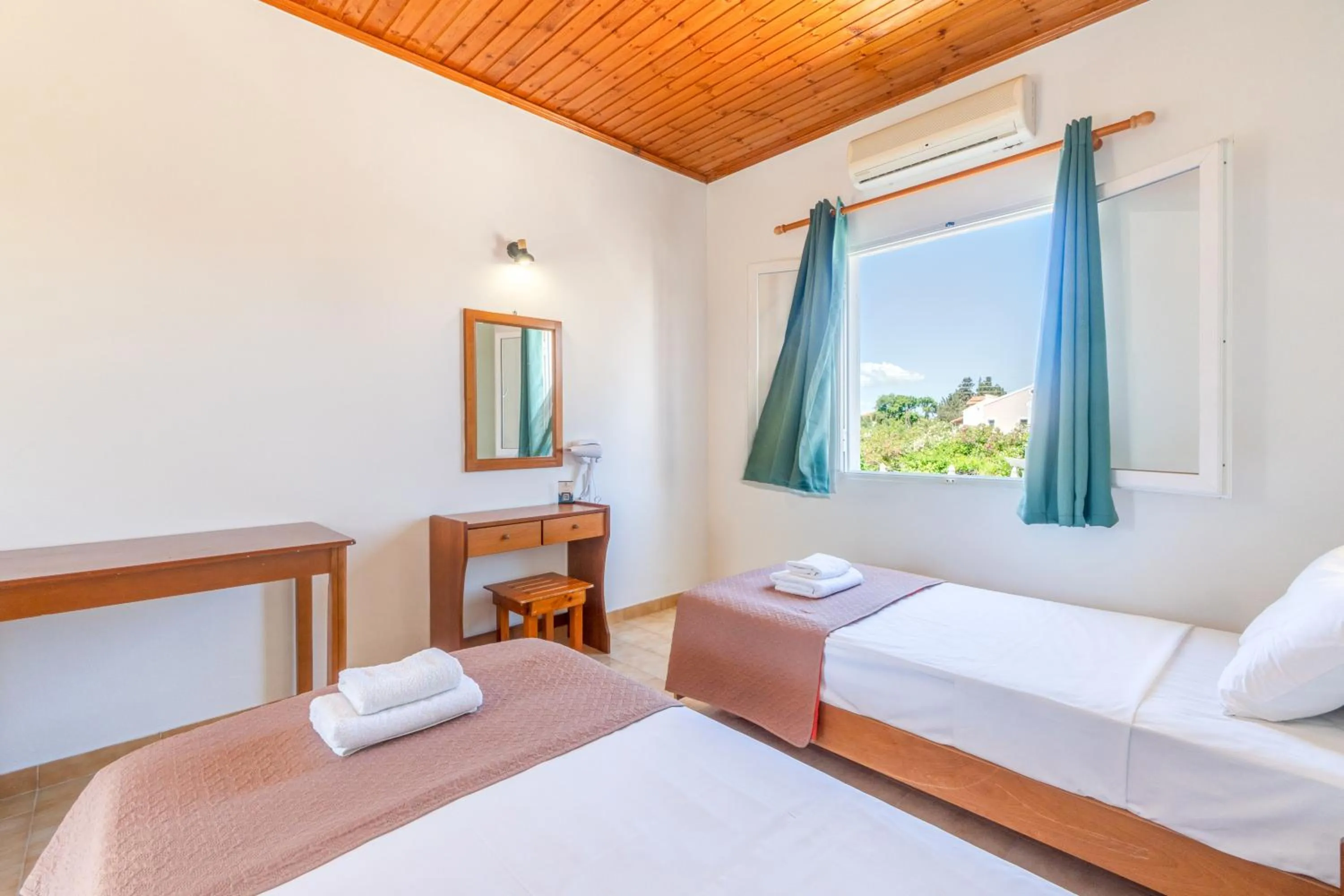 Bed in Sandy Beach Complex - Poolside Studios & Seaside Apartments