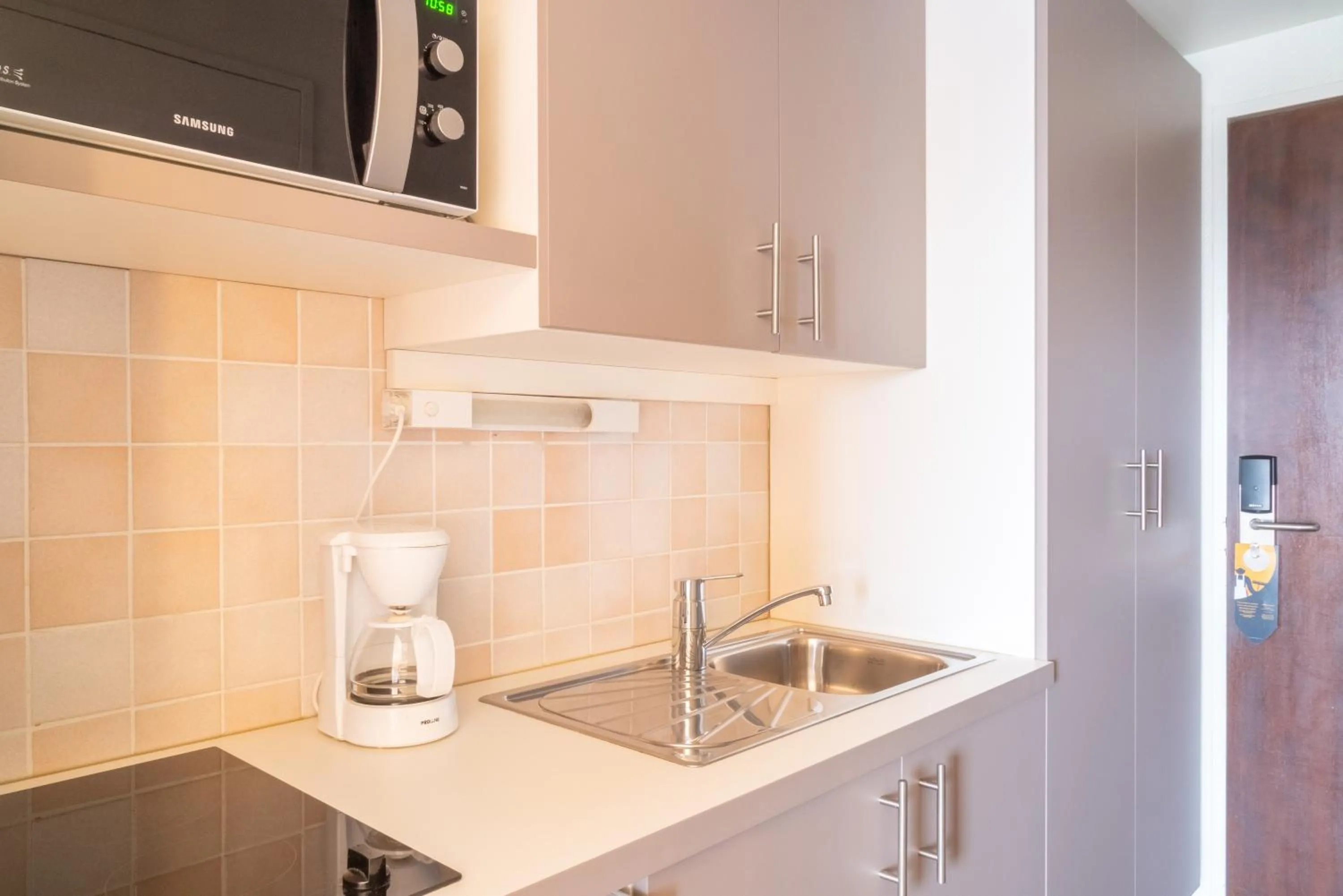 Kitchen or kitchenette in Brit Hotel Le Parc Vichy