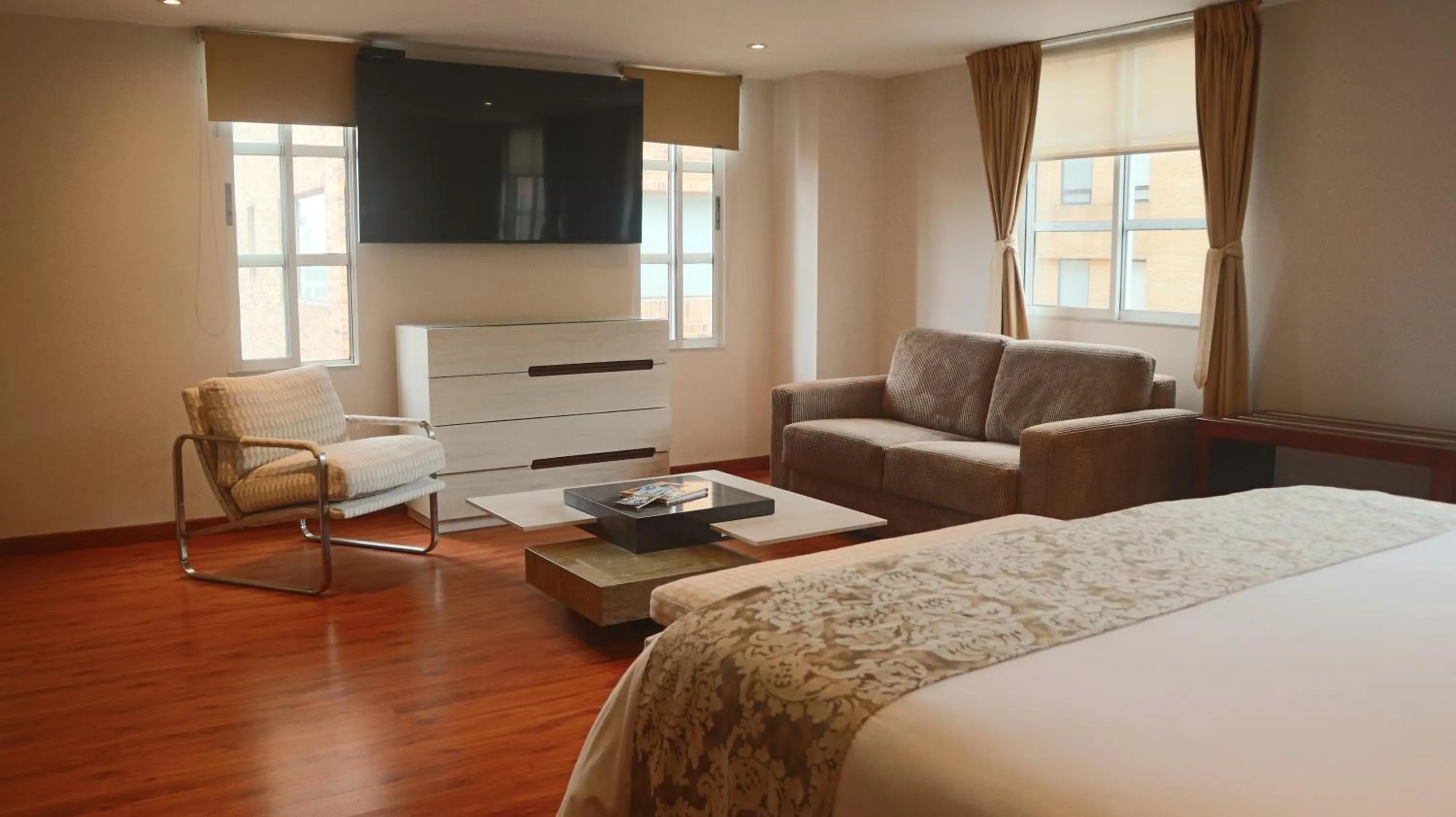 Living room, Bed in Hotel Portón de la Cabrera