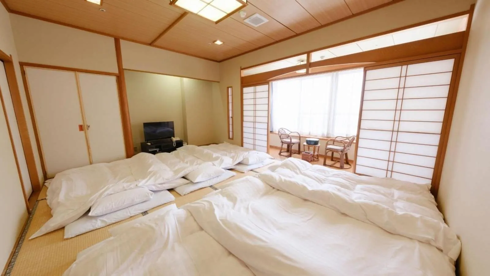 Bed in Sagayamato Onsen Hotel Amandi