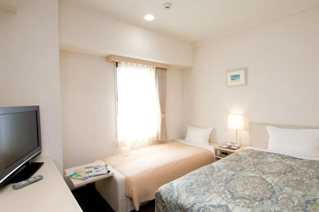 Bedroom, Bed in Hotel Unisite Mutsu