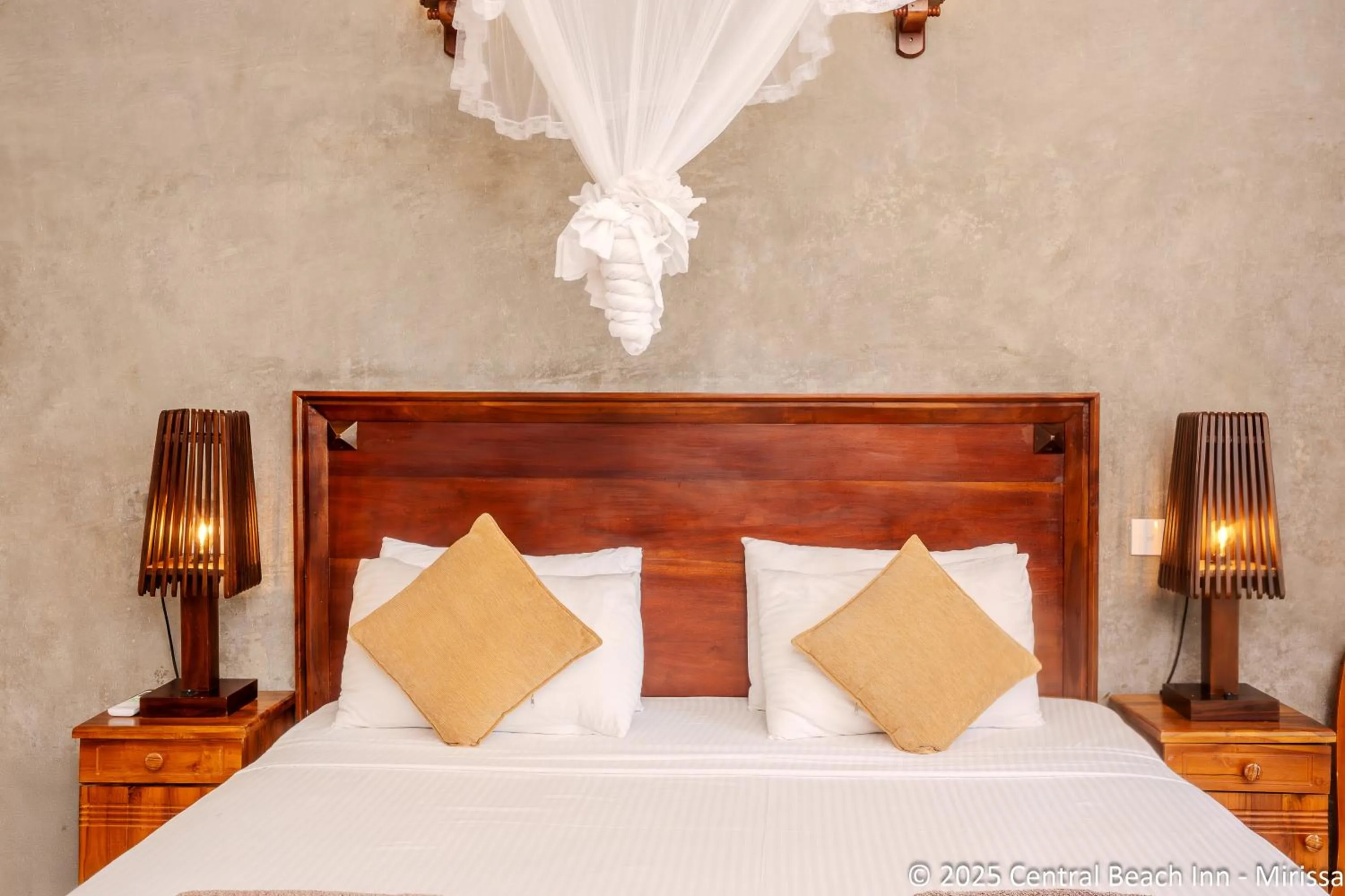 Bed in Central Beach Inn