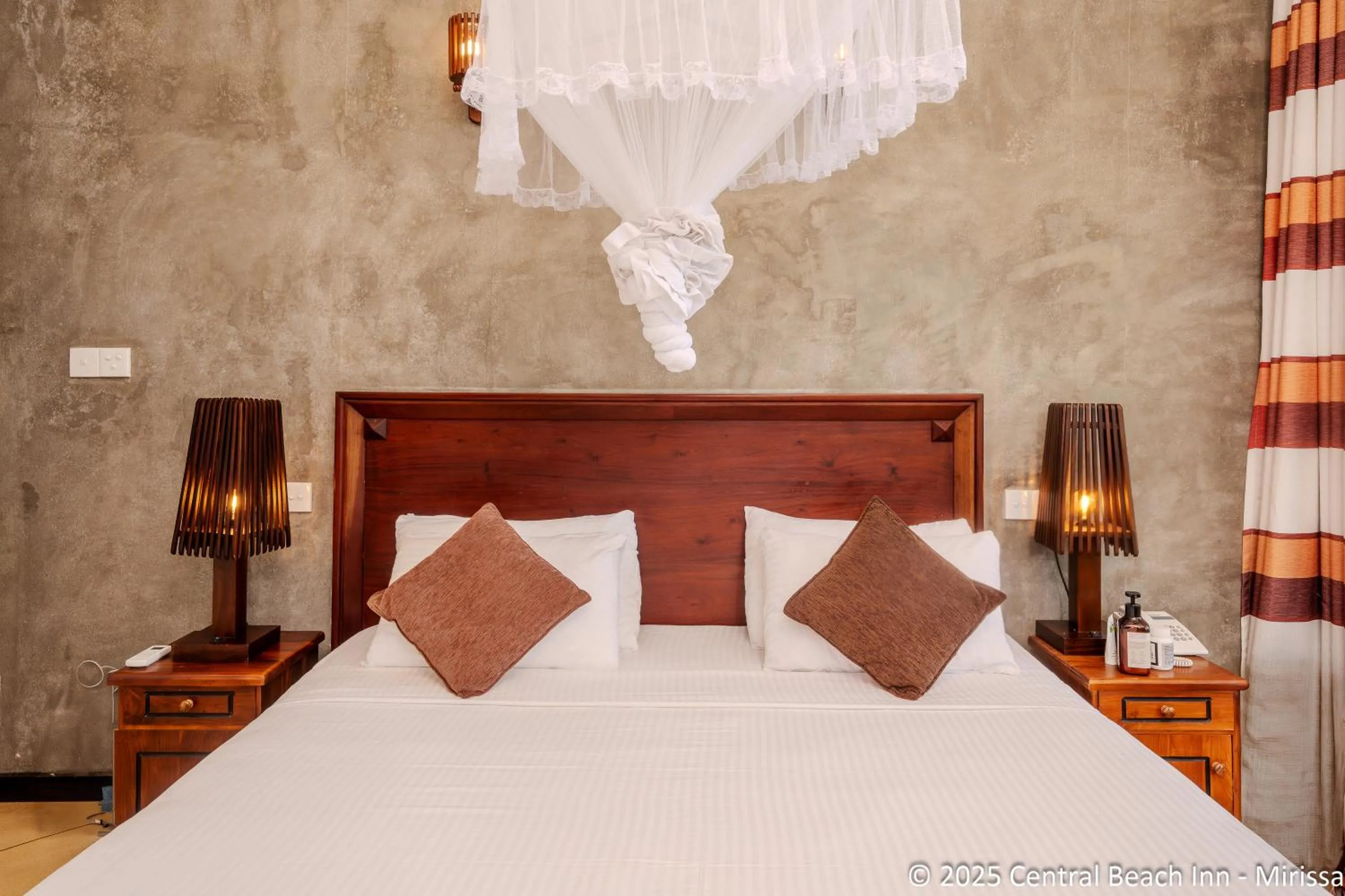 Bed in Central Beach Inn