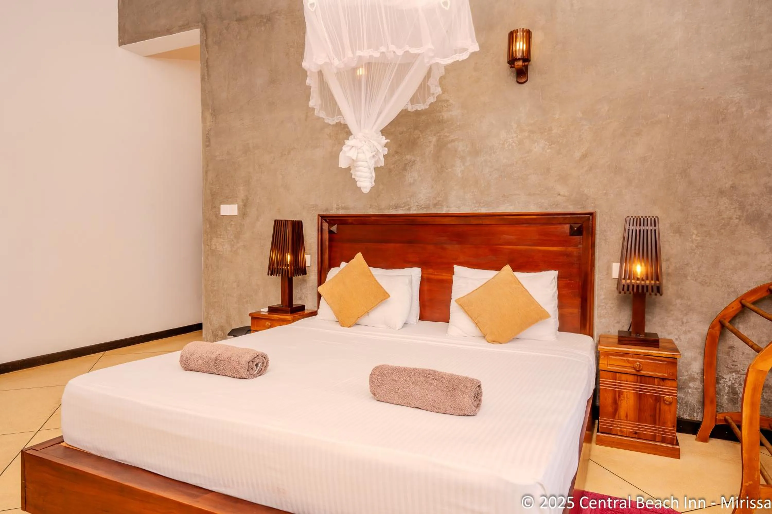 Bed in Central Beach Inn