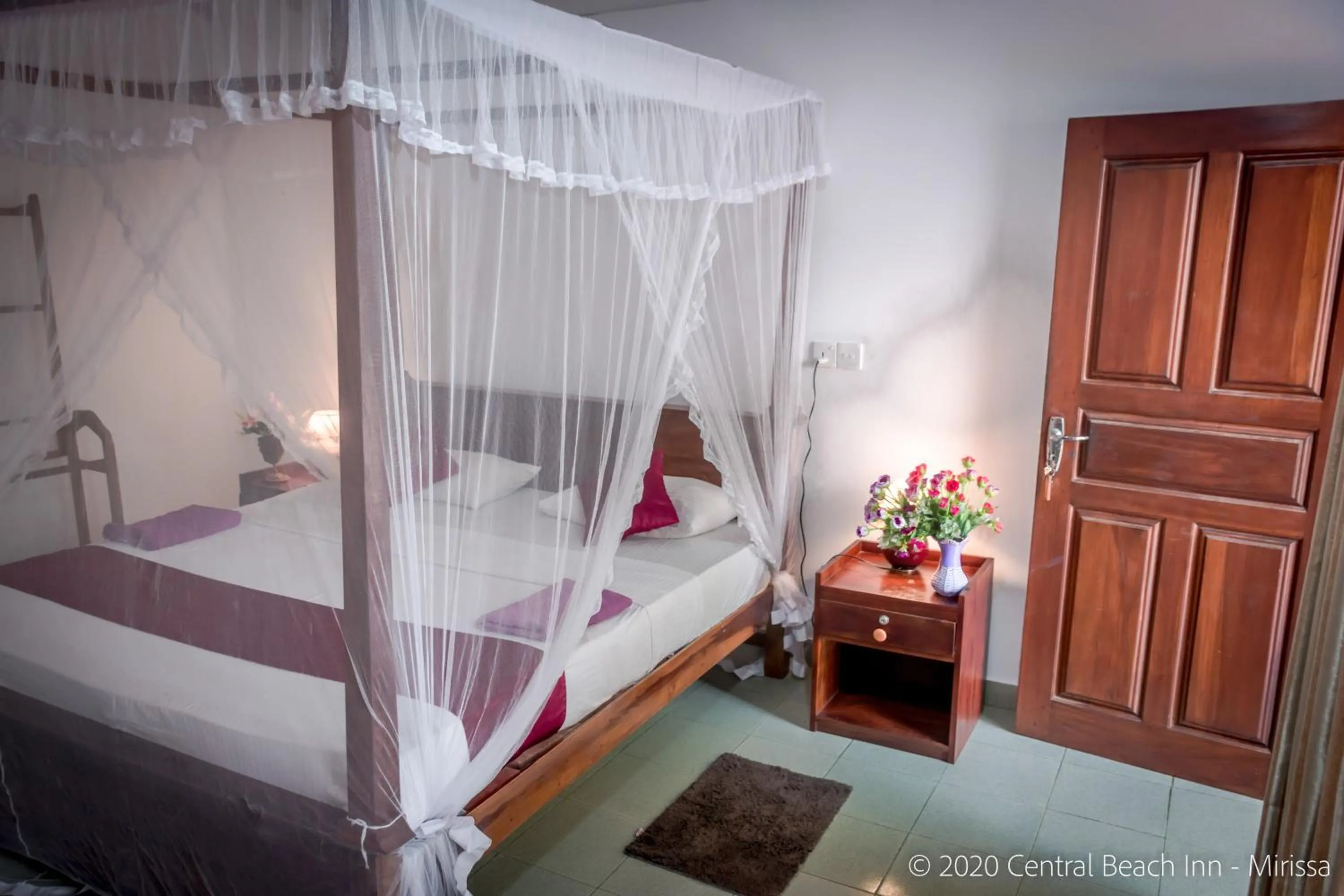 Bed in Central Beach Inn