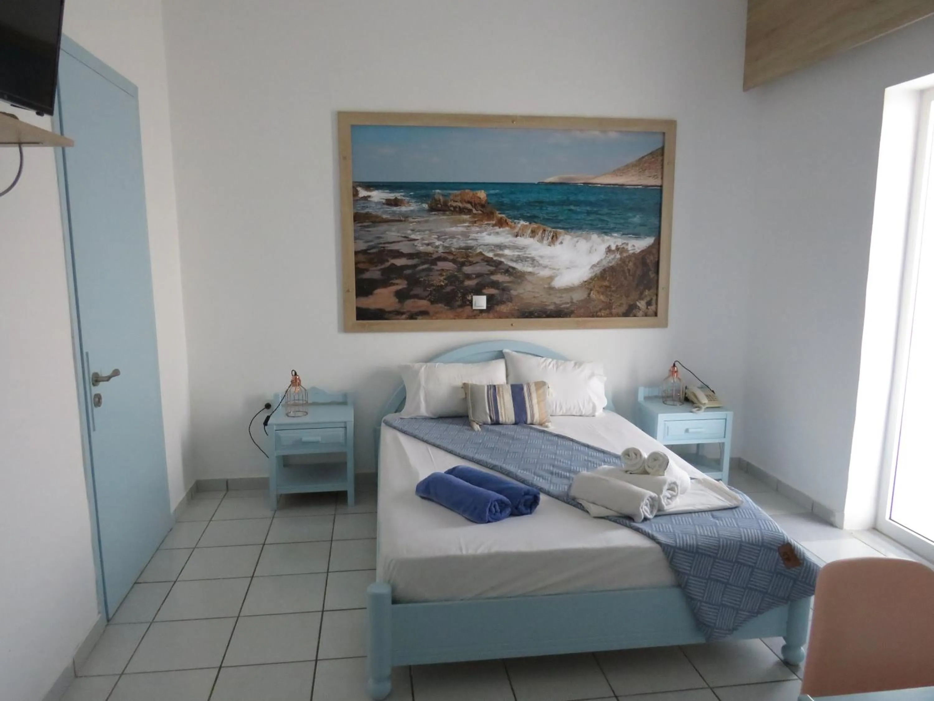Bed in Blue Beach Villas Apartments
