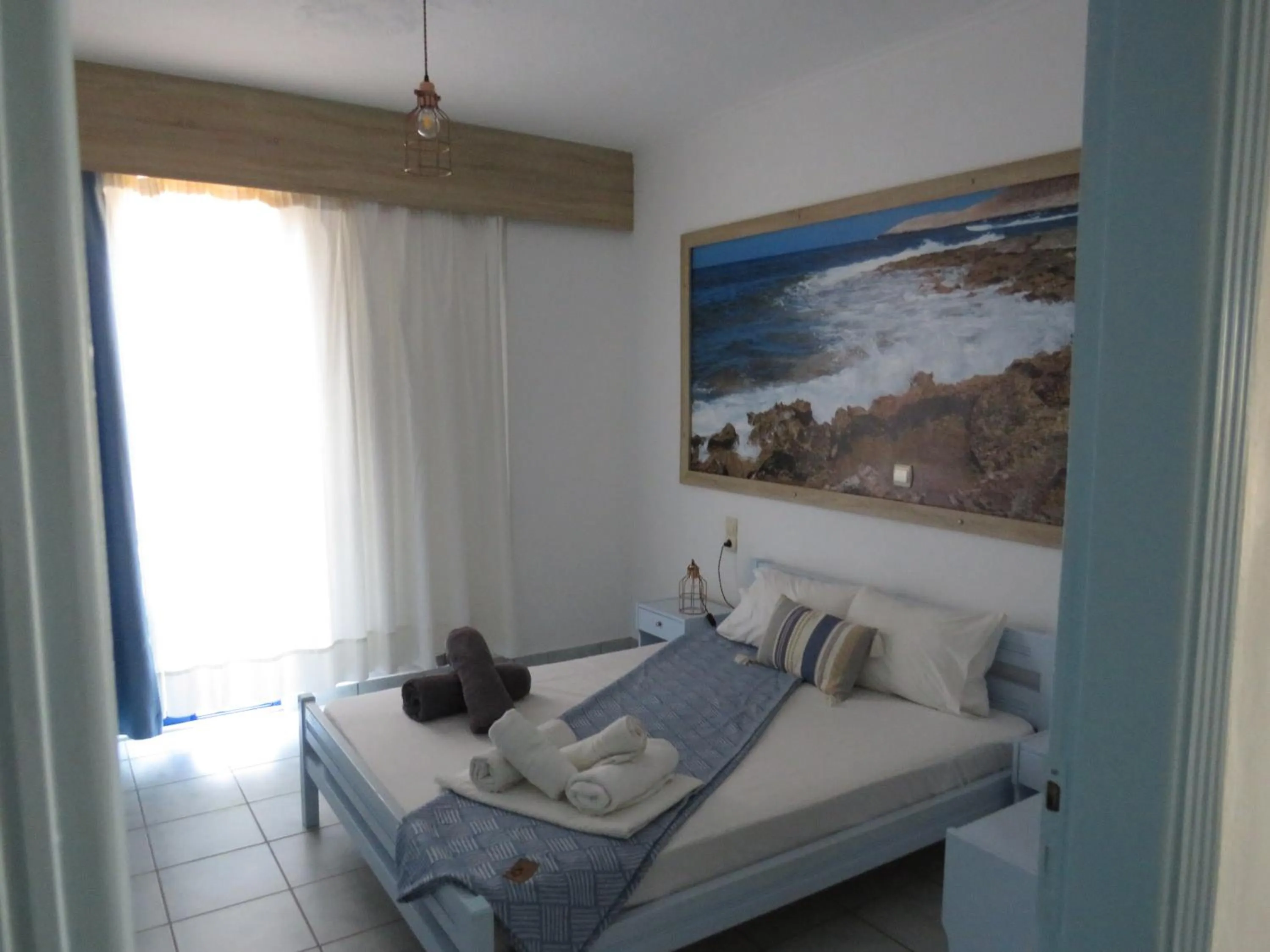 Bed in Blue Beach Villas Apartments
