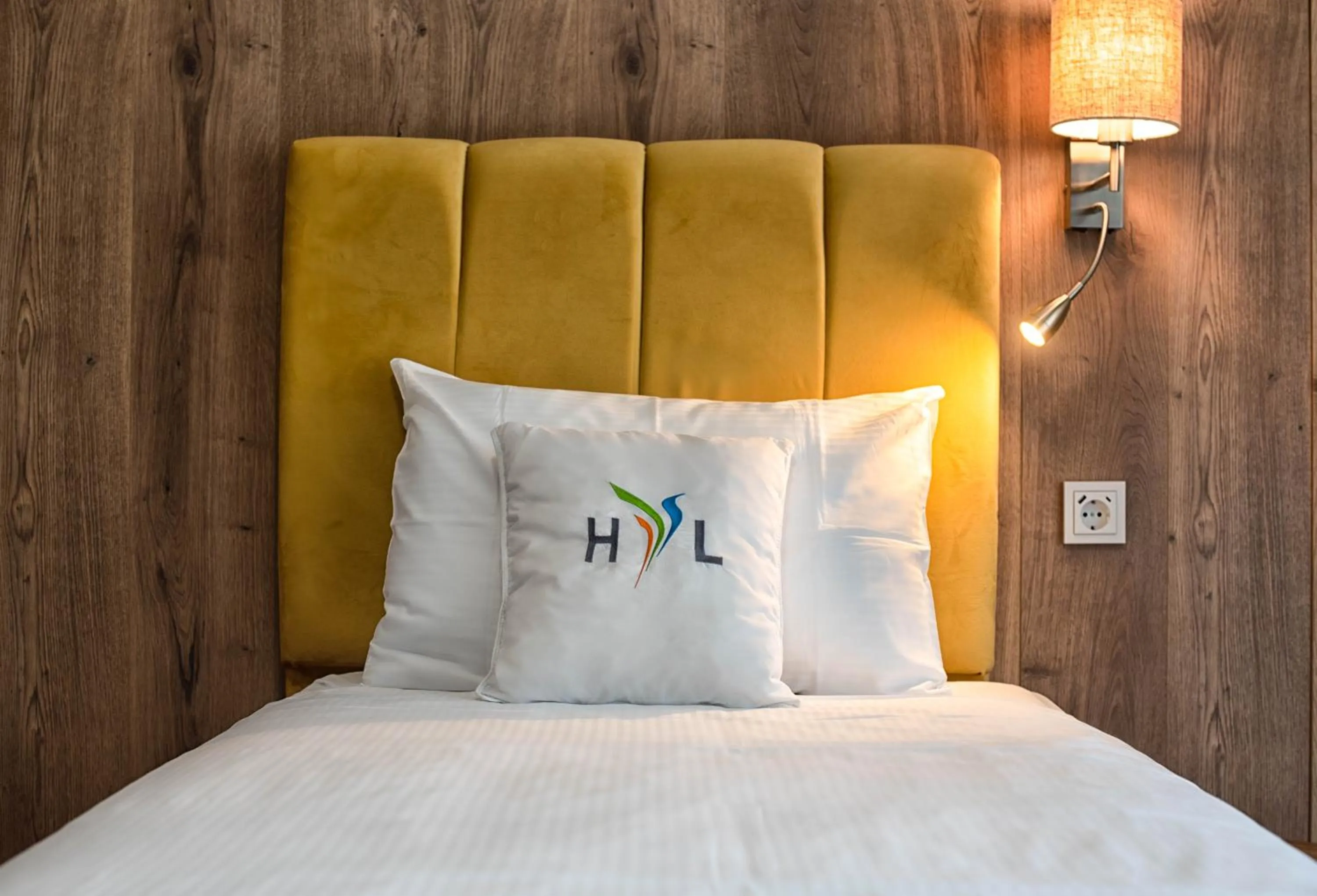 Decorative detail, Bed in Hotel Residence Loren - contact & contactless check-in