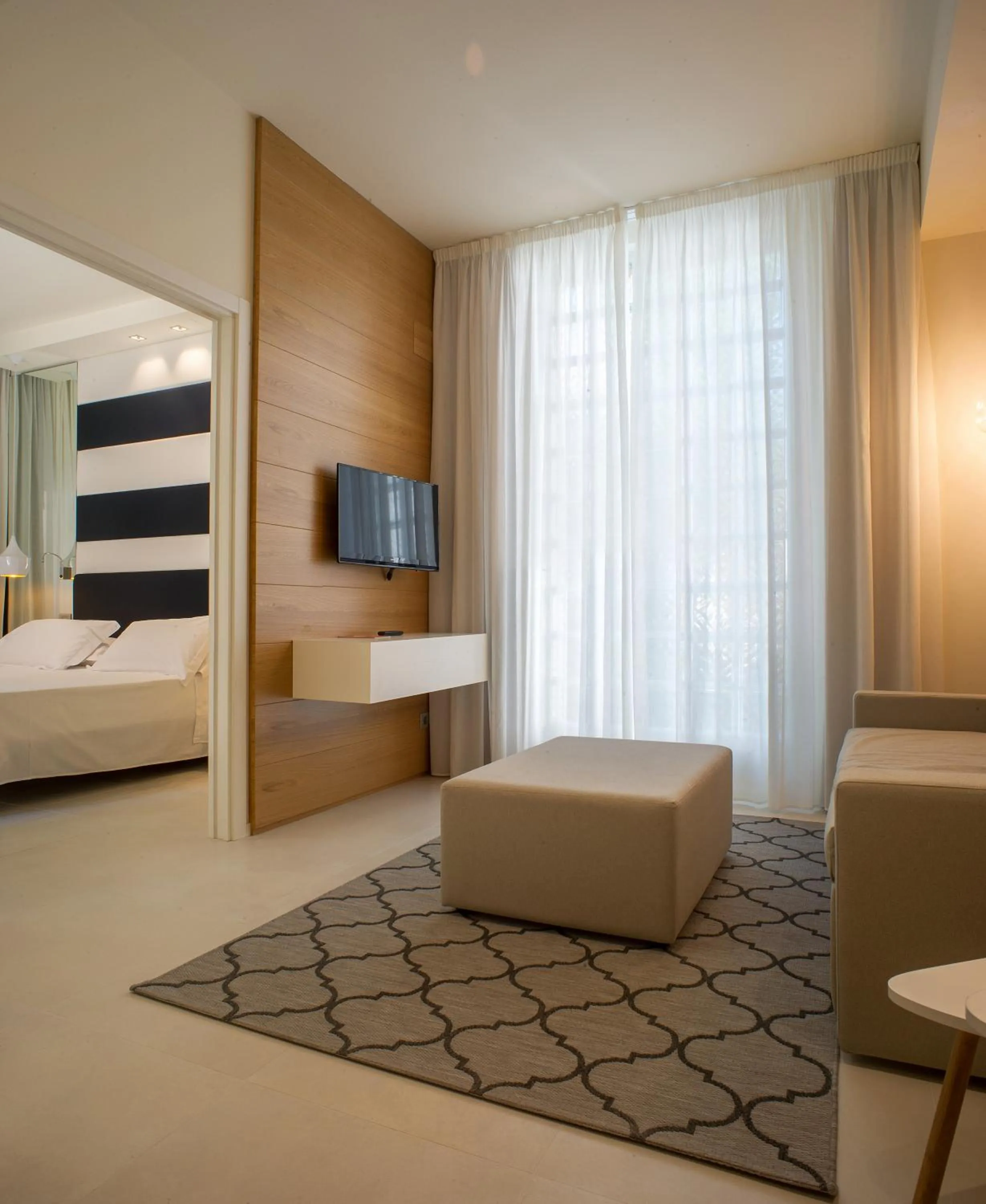 Living room, Bed in Metropol Ceccarini Suite - Luxury apartments