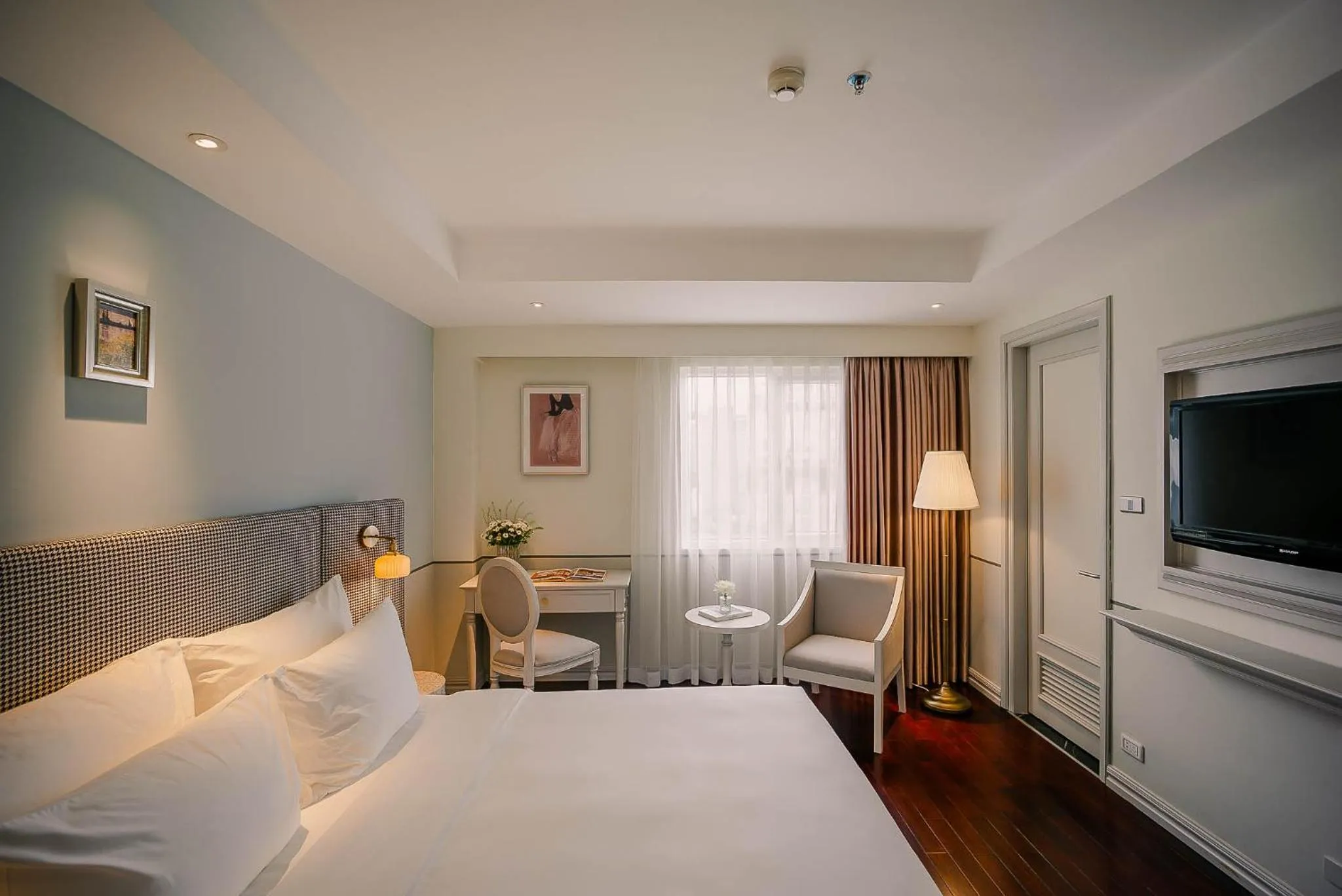 Bed in Le Jardin Hotel Haute Couture