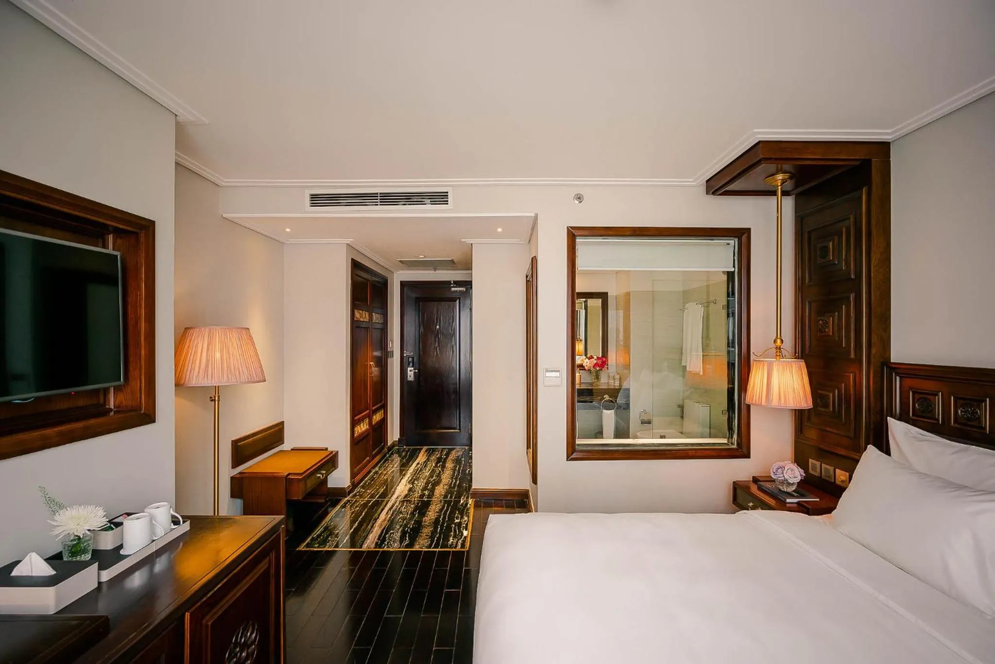 Bed in Le Jardin Hotel Haute Couture