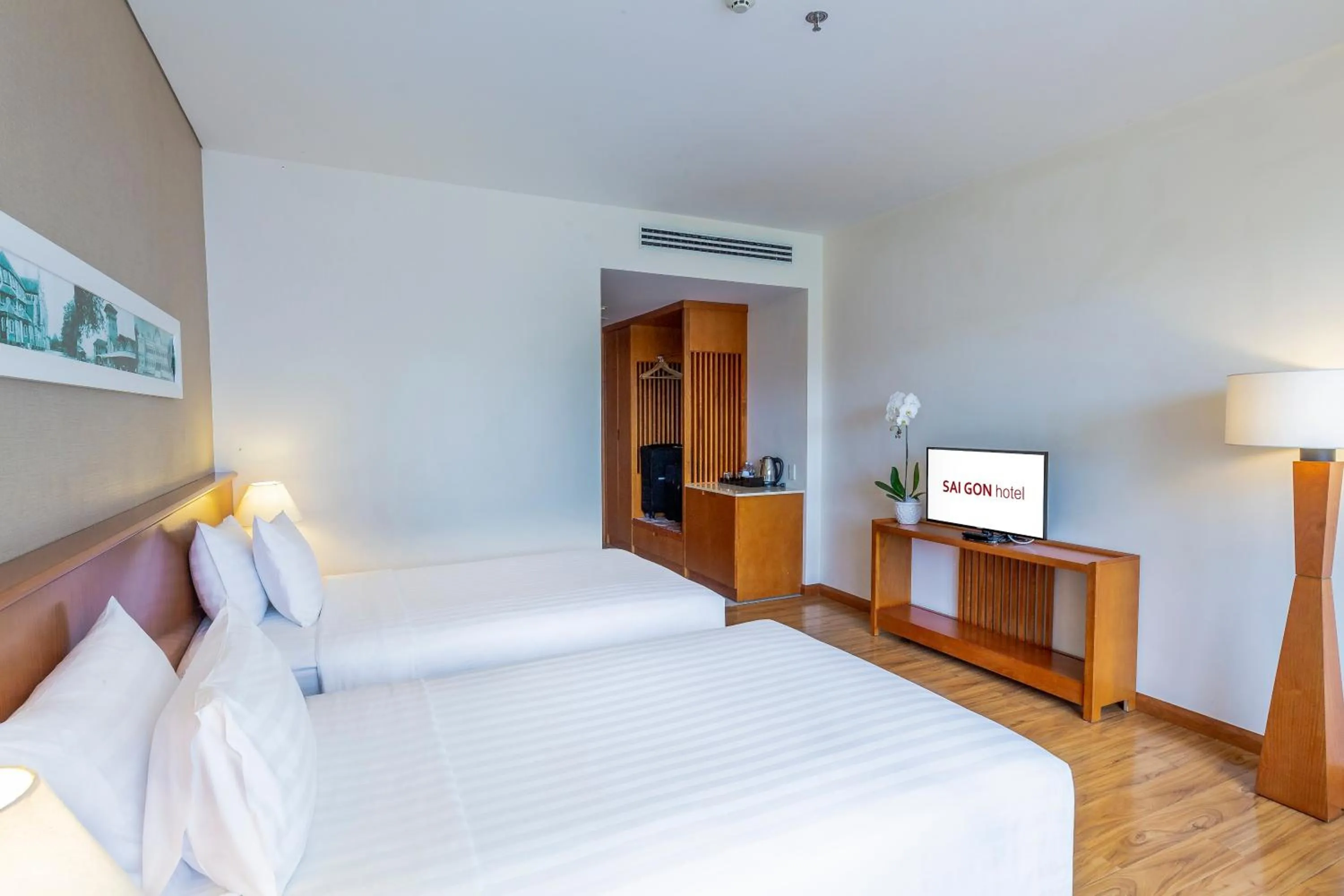 Photo of the whole room, Bed in Saigon Hotel