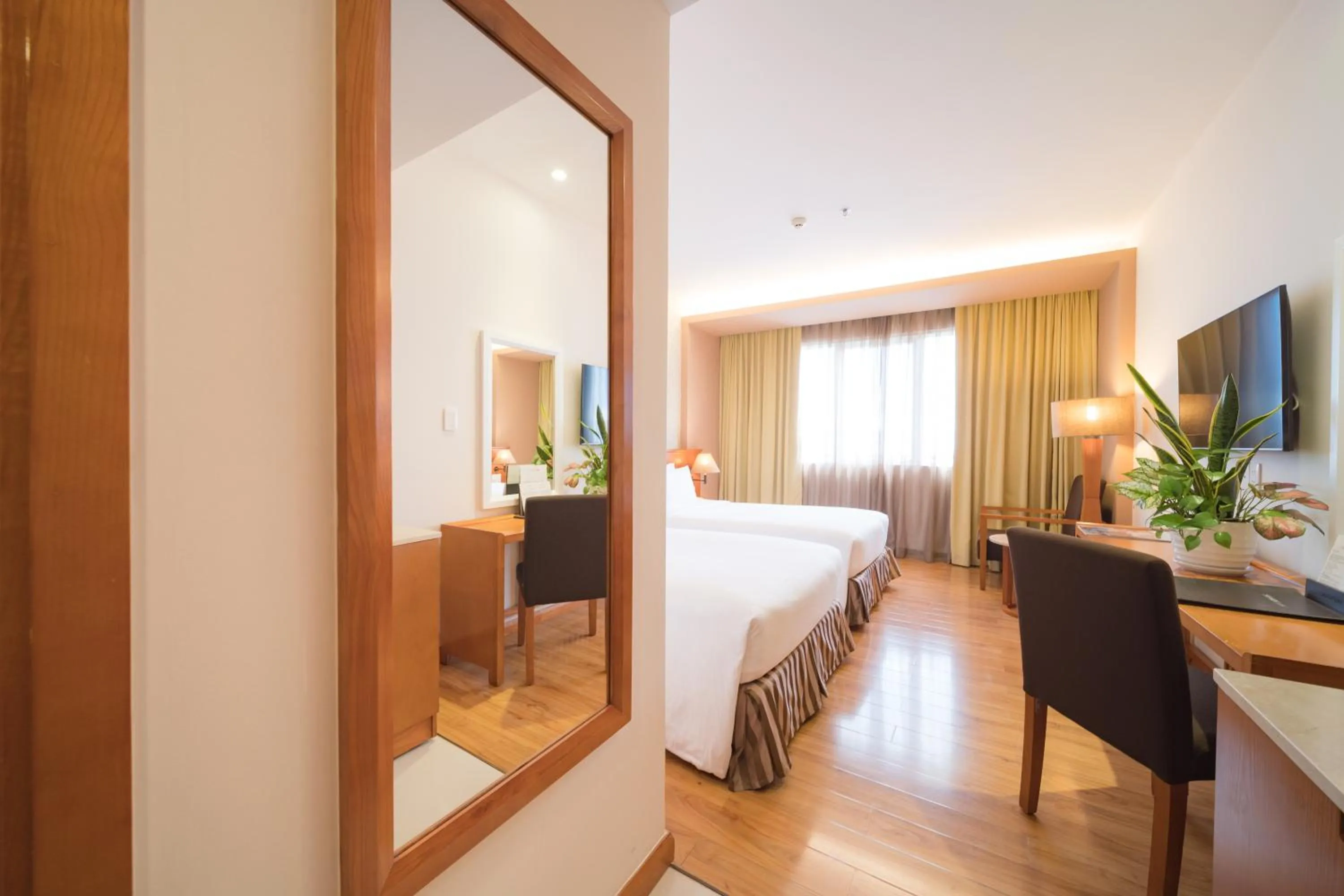 Communal lounge/ TV room, Bed in Saigon Hotel